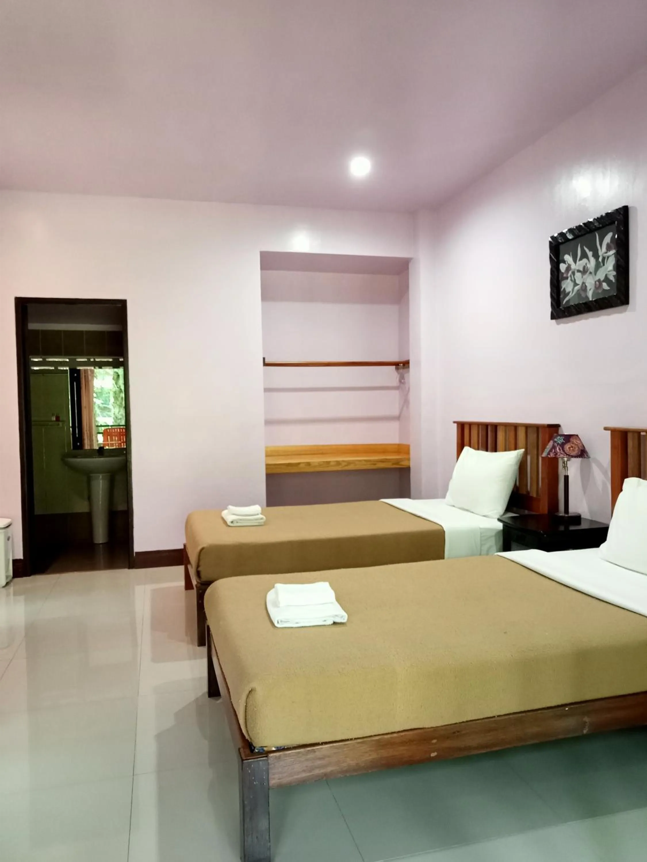 Bed in Khao Sok Palm Garden Resort