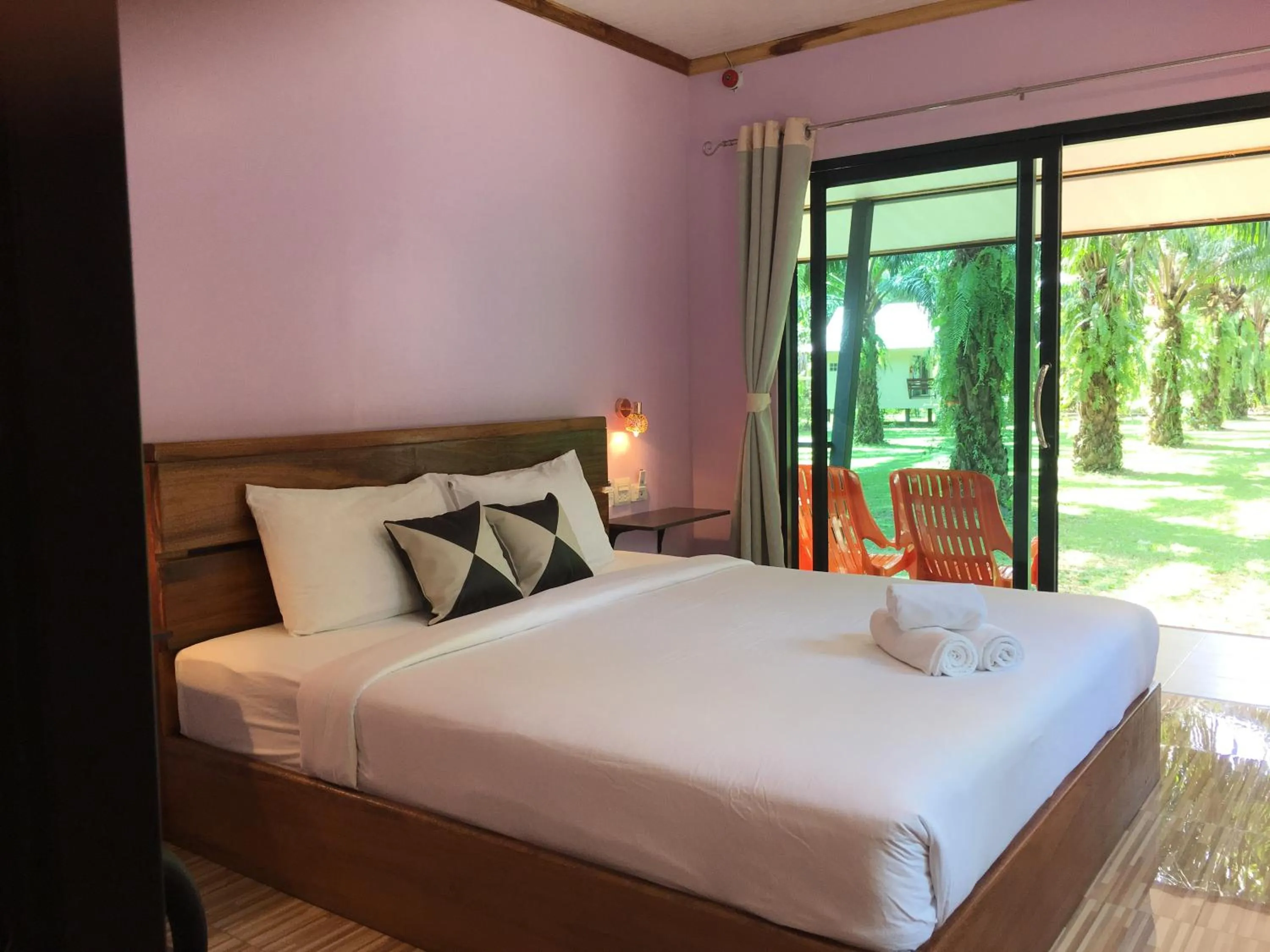 Bed in Khao Sok Palm Garden Resort