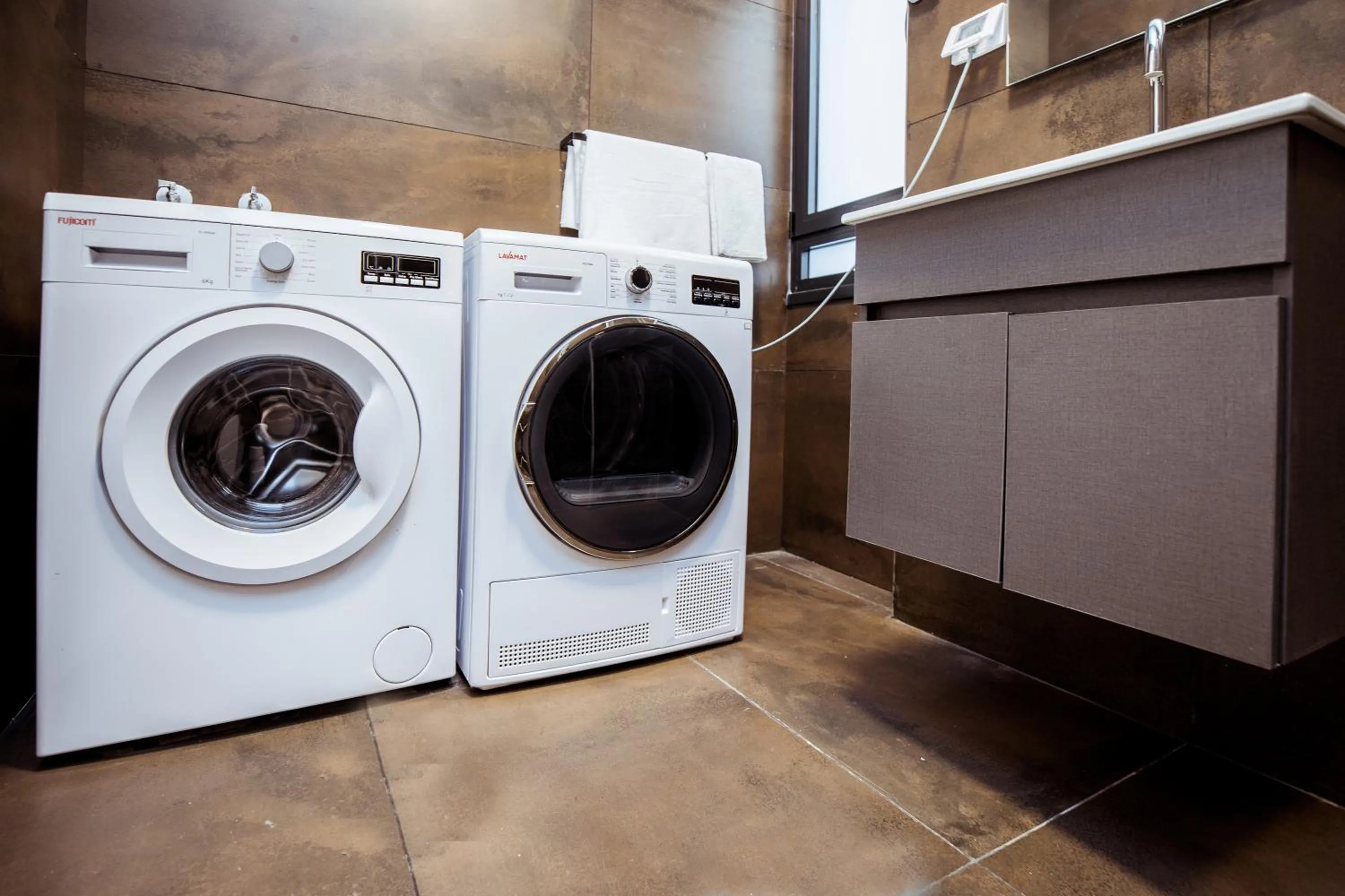washing machine in Herzl Boutique Hotel & Apartments by Domus