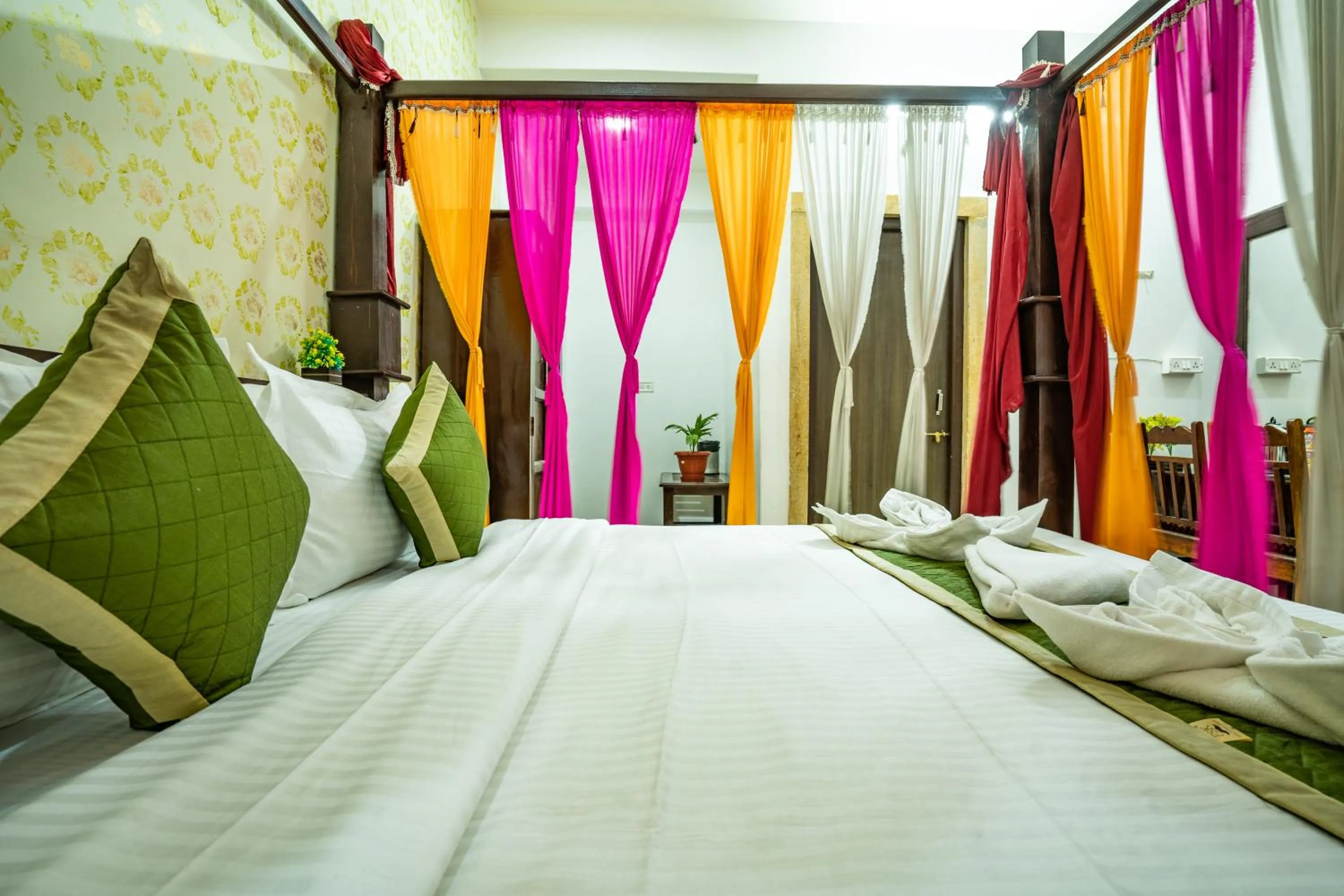 Bed in Hotel Marina Mahal with Swimming Pool