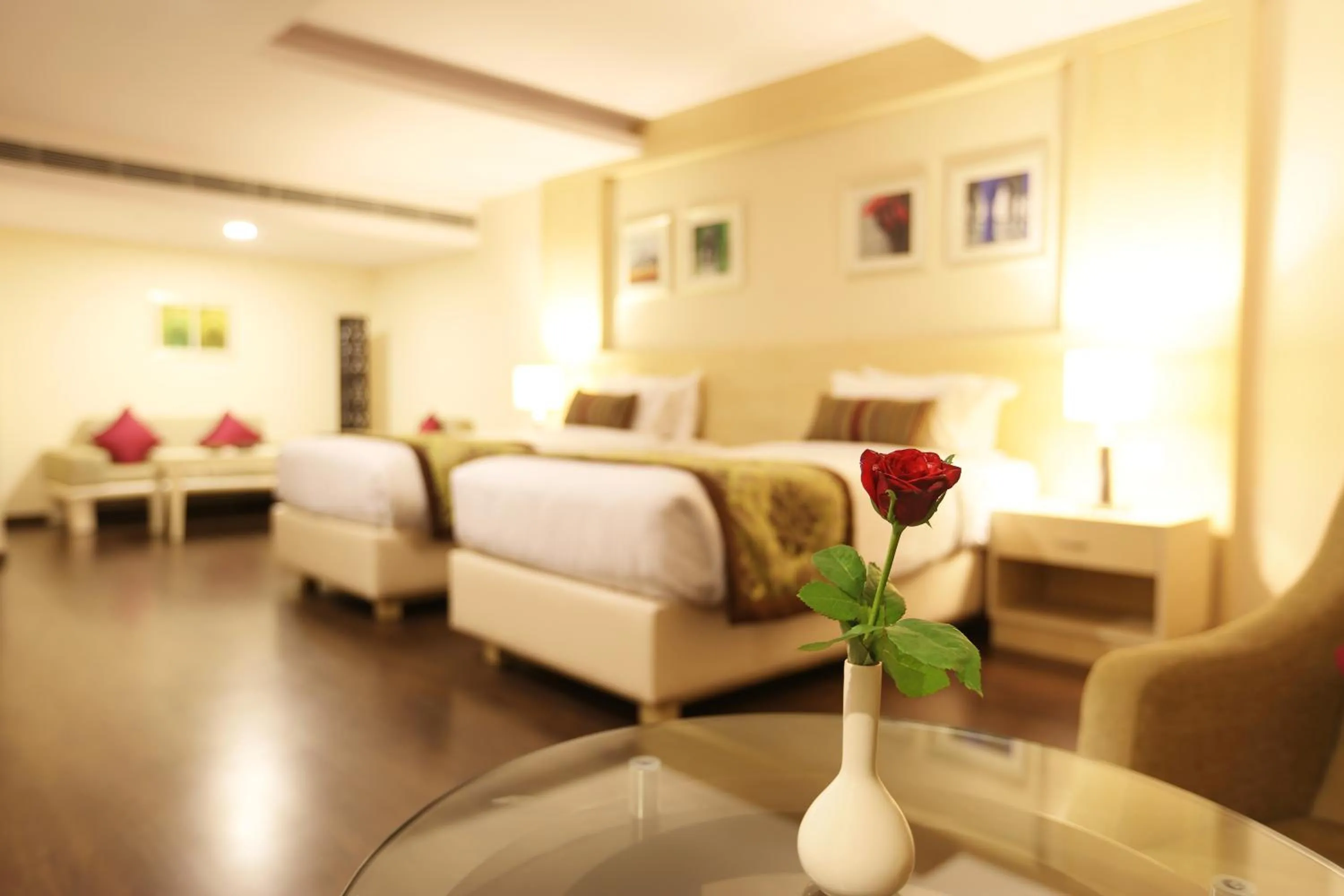 Photo of the whole room, Bed in Golden Tulip Jaipur City Center