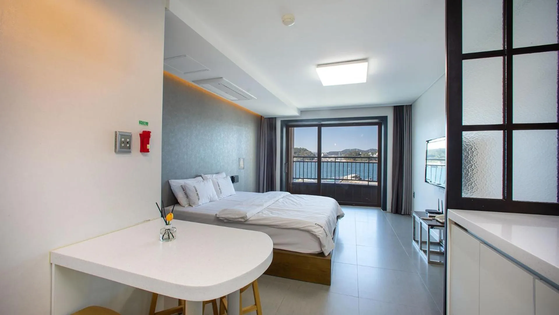 Bed in Carib Condo Hotel