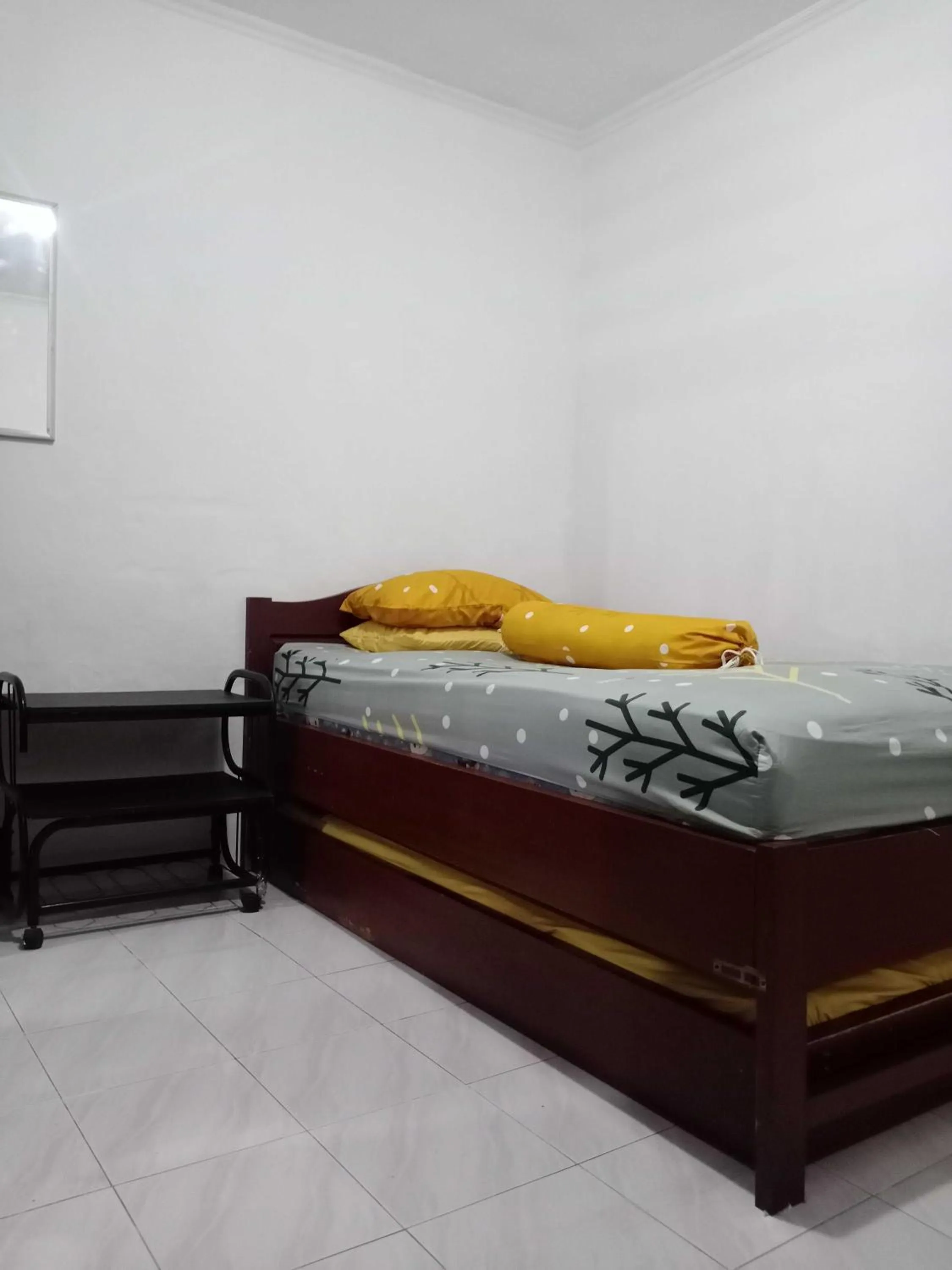 Bedroom in SPOT ON 91597 Sharie Homestay Syariah