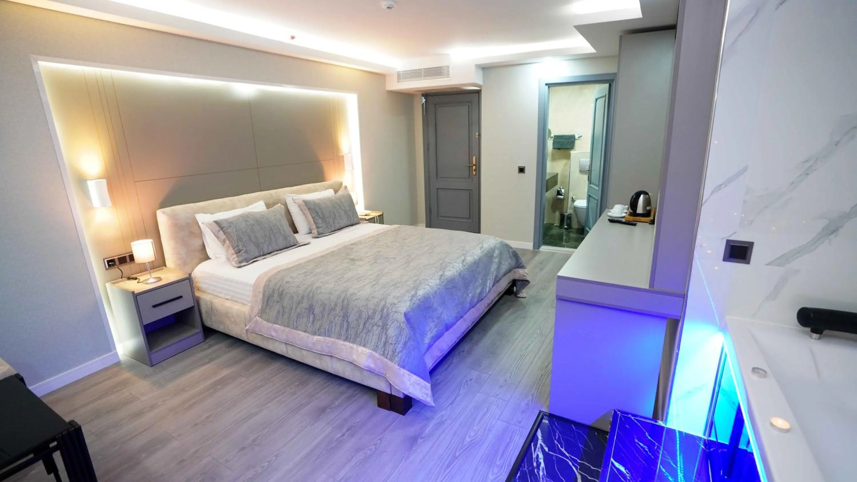 Bed in AURA MARINA HOTEL