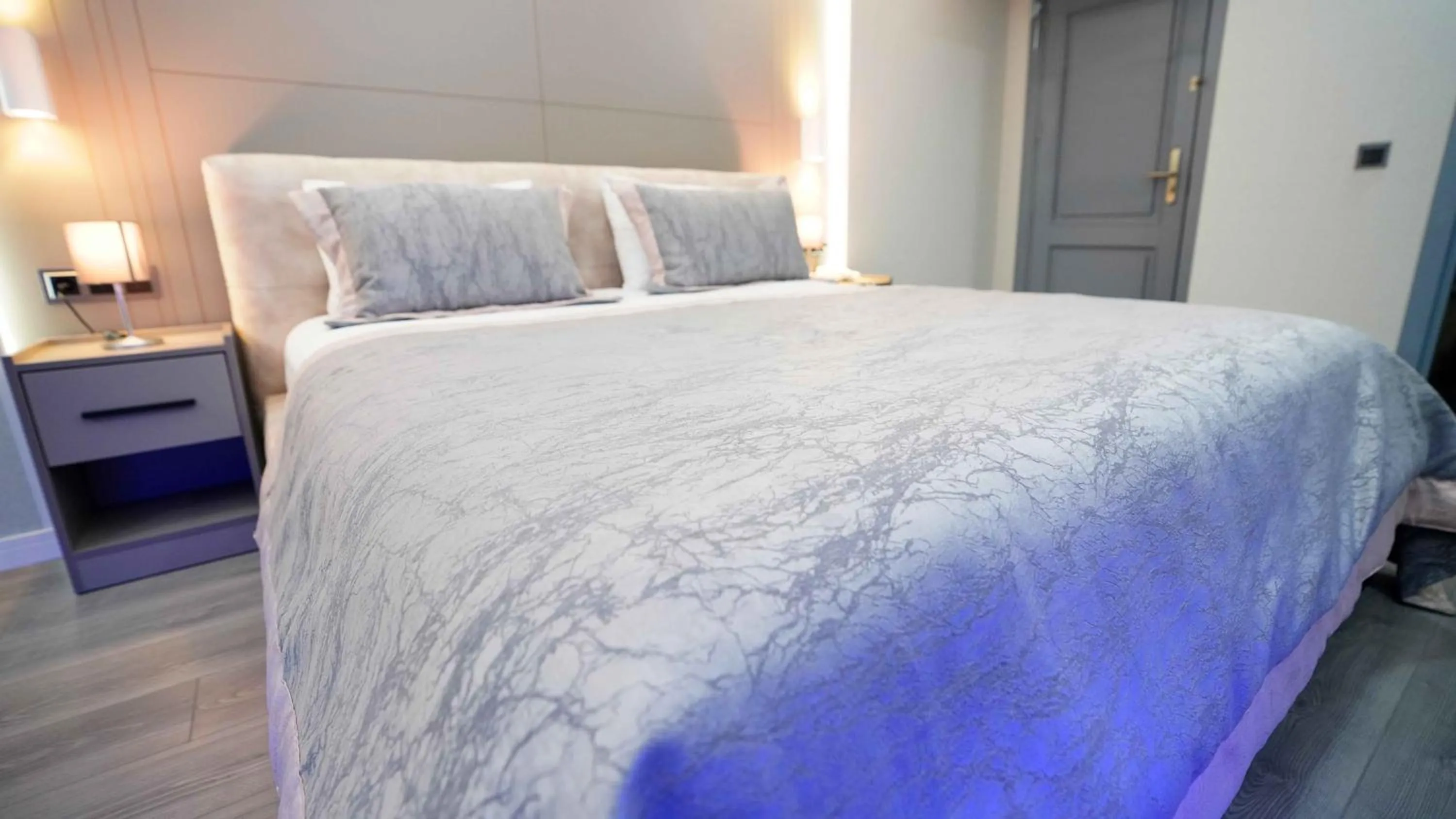 Bed in AURA MARINA HOTEL