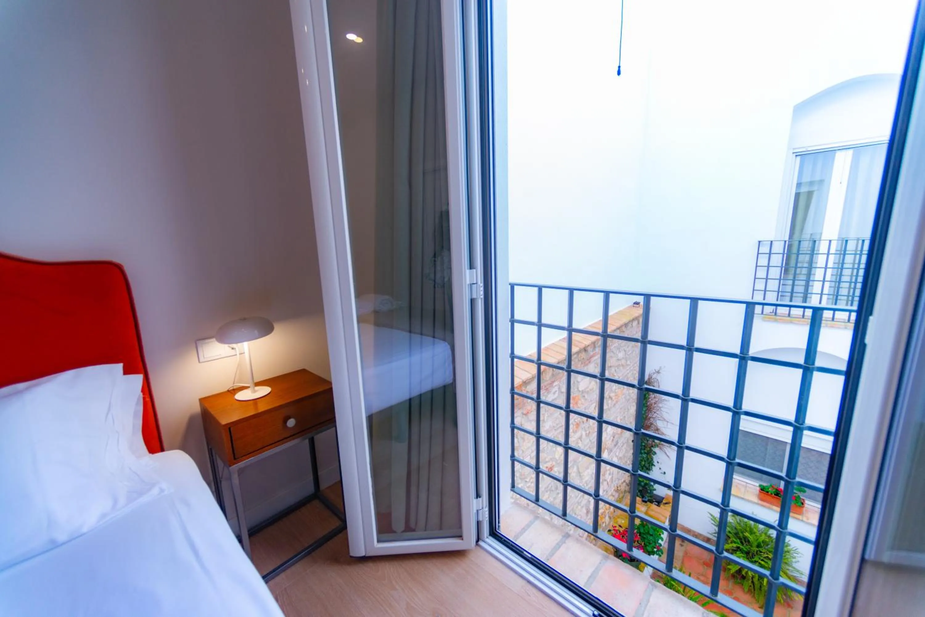 Balcony/Terrace, Bed in Suites Casa San Mateo