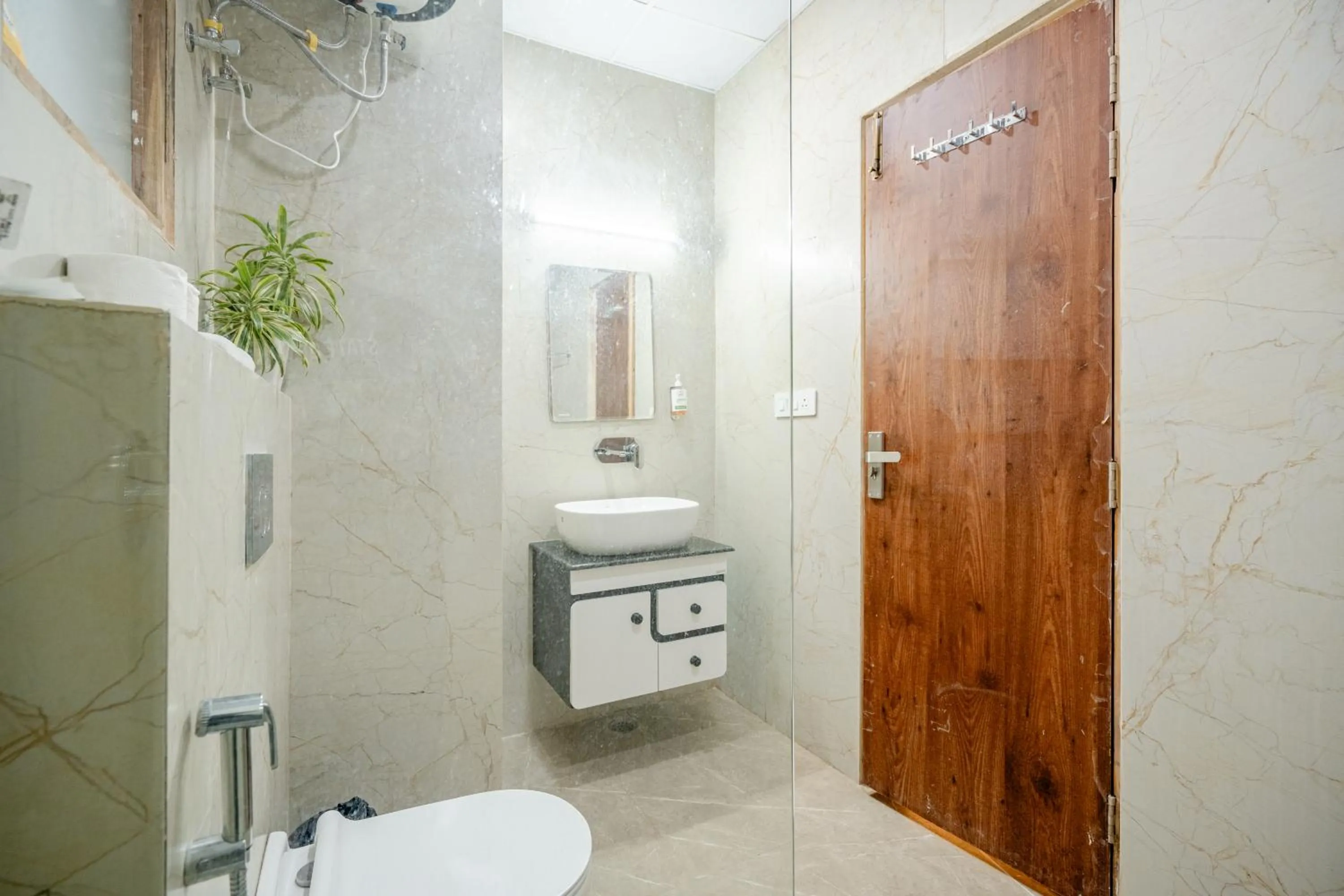Toilet in Lime Tree Hotels and Banquet Greater Noida