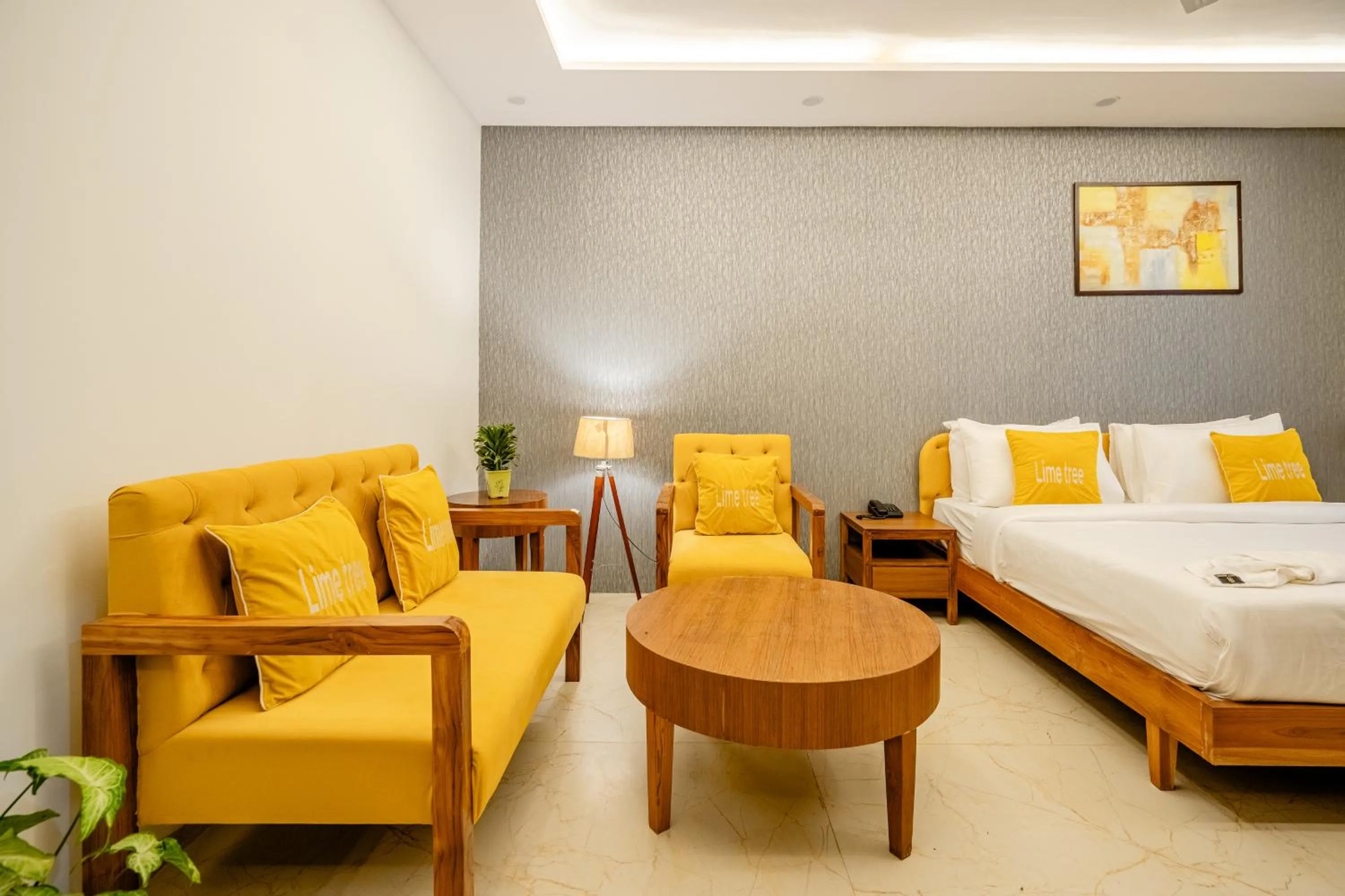 Living room, Bed in Lime Tree Hotels and Banquet Greater Noida