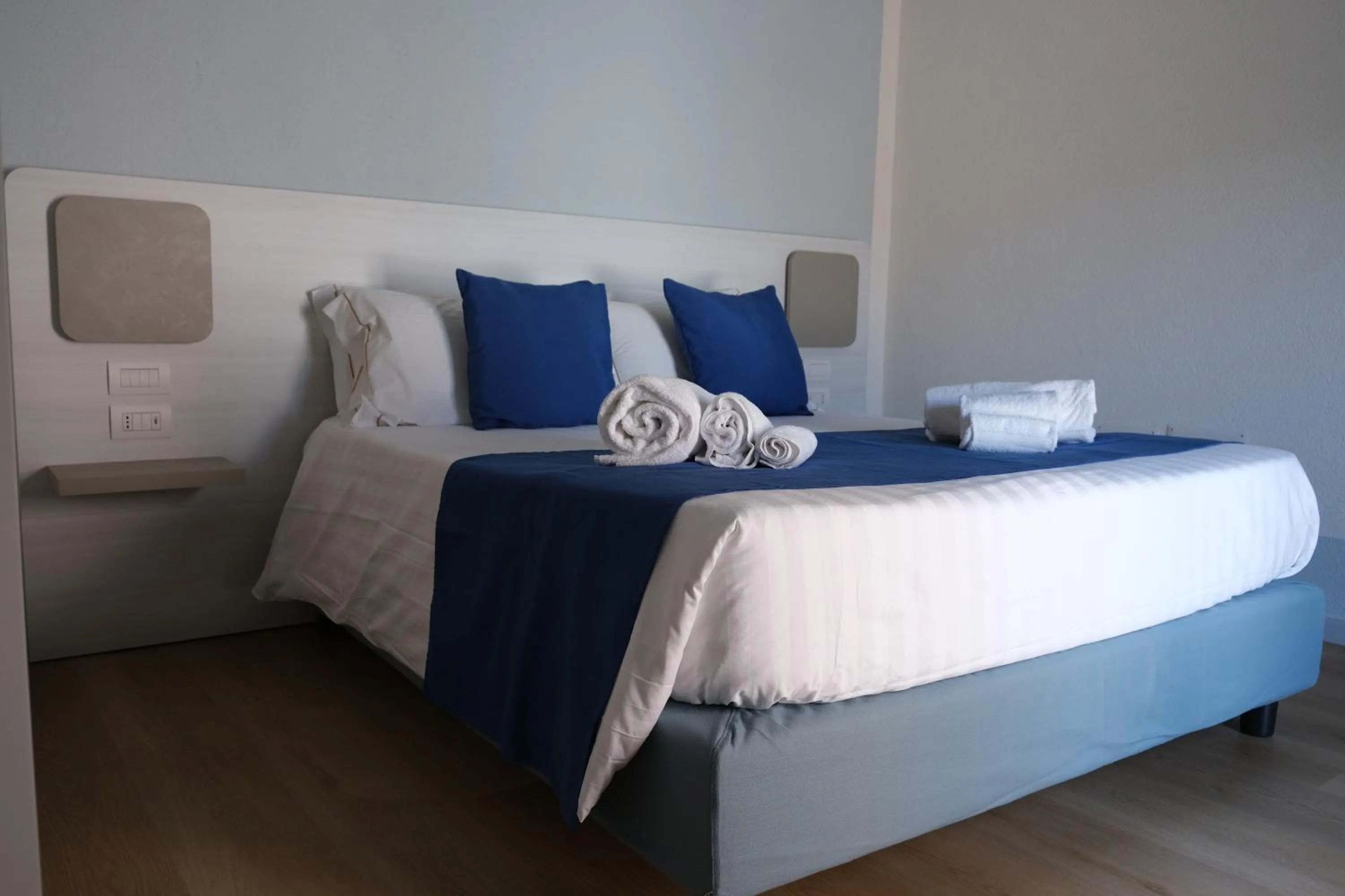 Bed in TANIT ROOMS & SPA