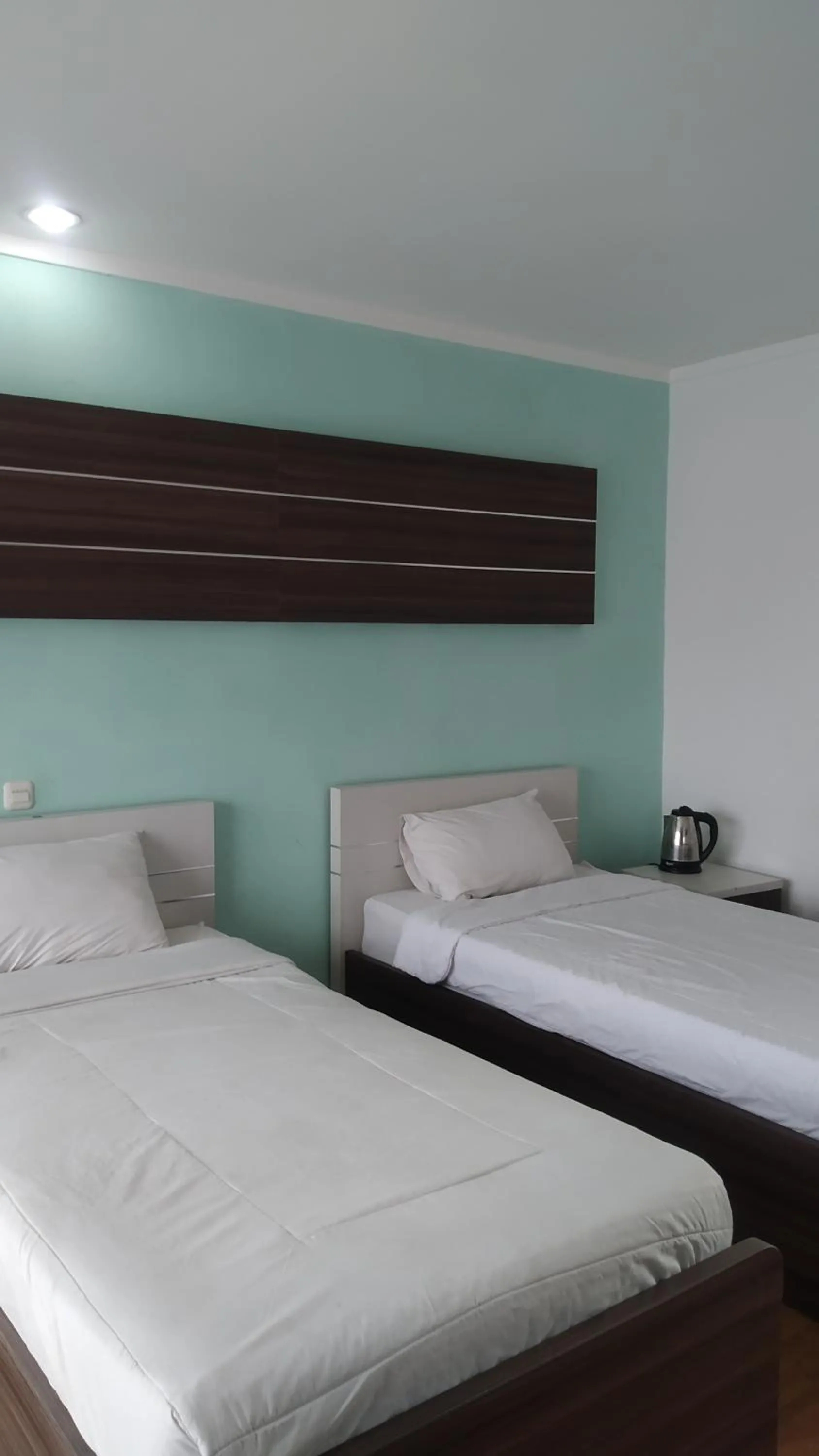 Bed in PUNCAK VILLAGE HOTEL & KAMPUNG MAIN ANAK