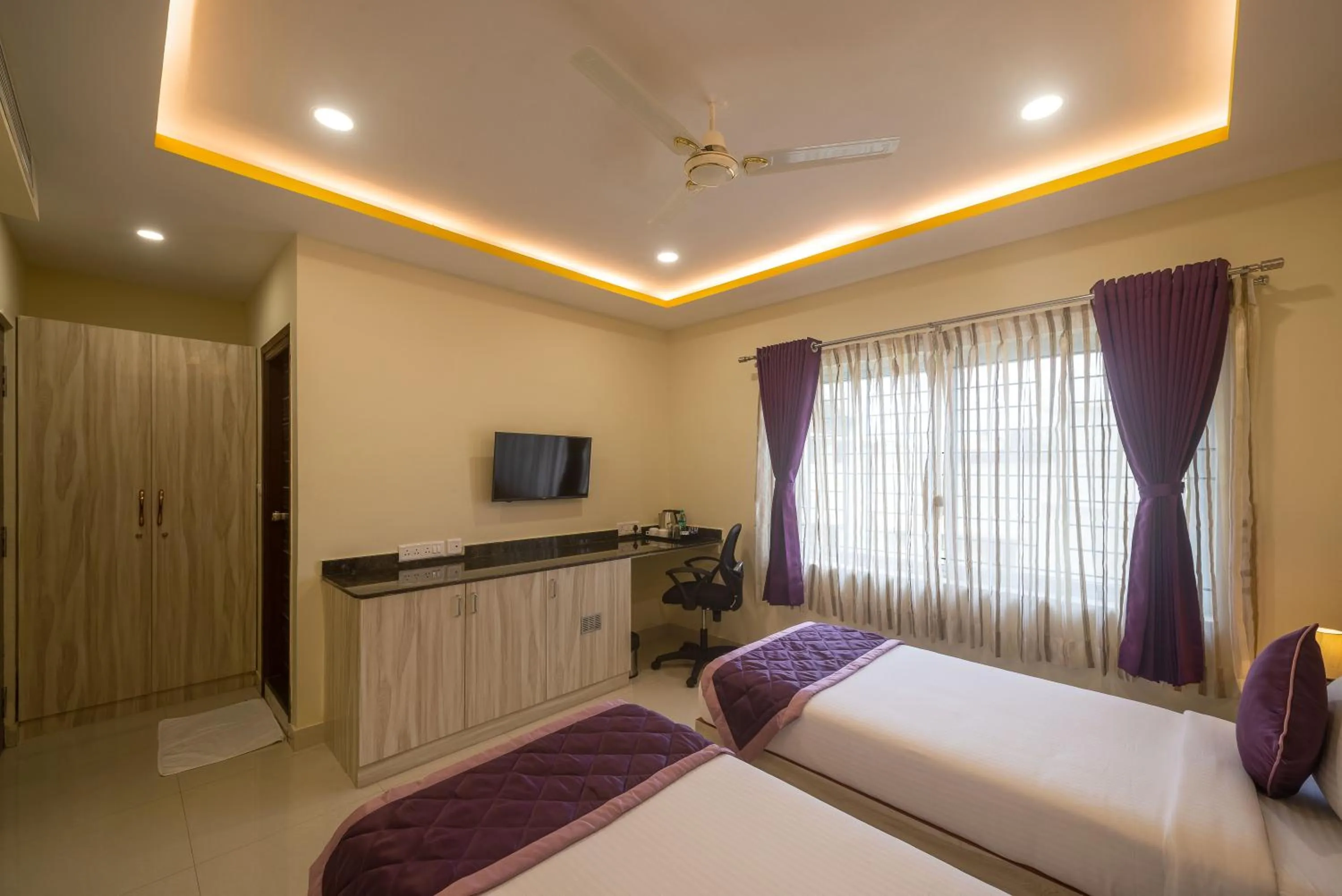 TV and multimedia, Bed in Zenith Hotels Hebbal Bangalore