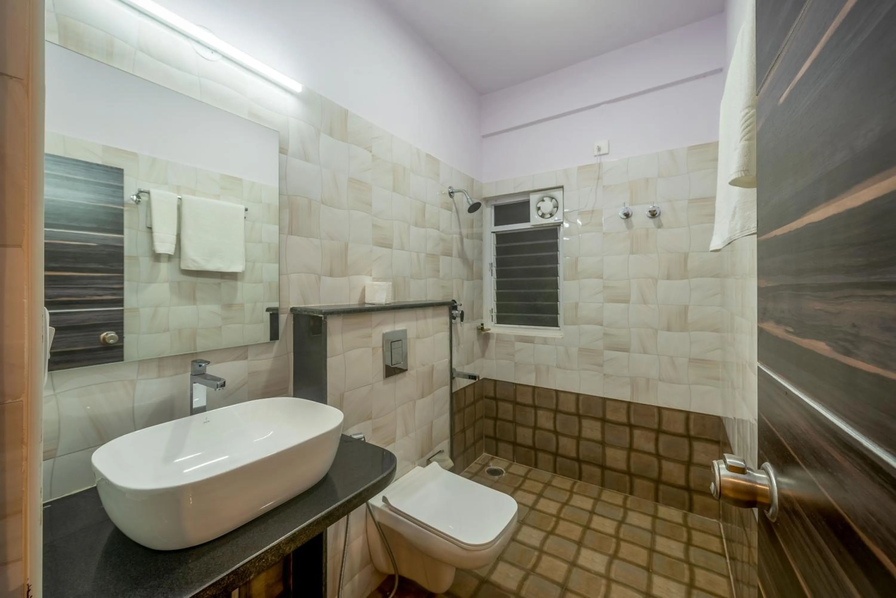 Shower in Zenith Hotels Hebbal Bangalore