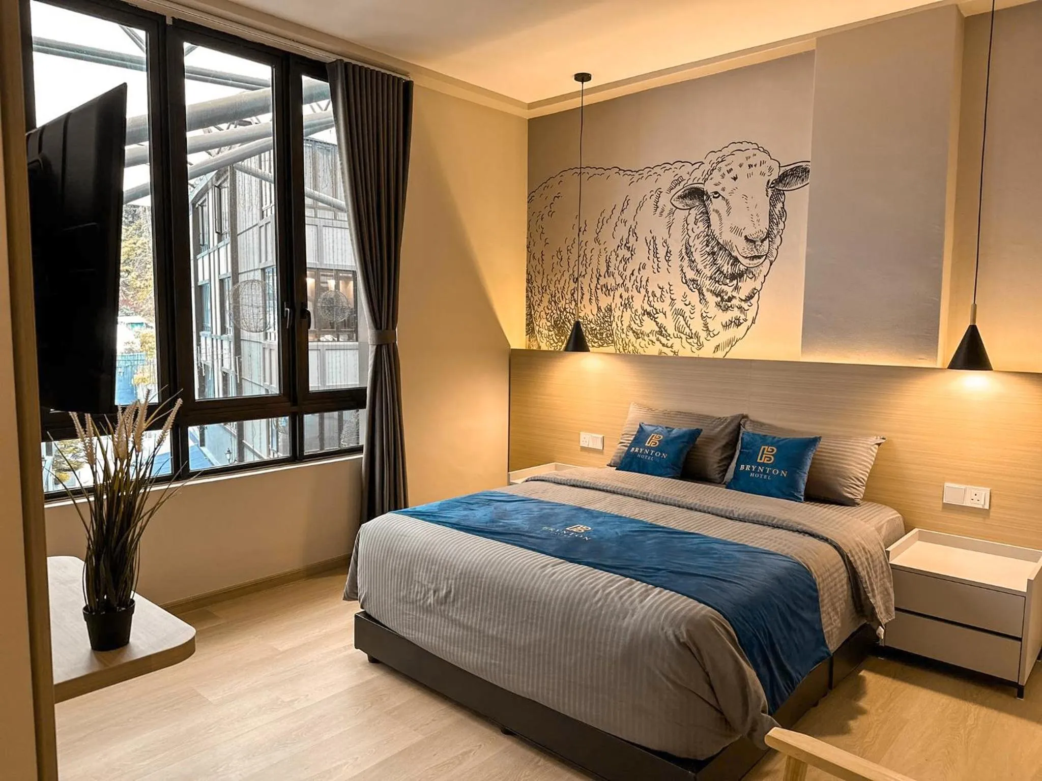 Bed in Hotel Brynton at Cameron Centrum Mall