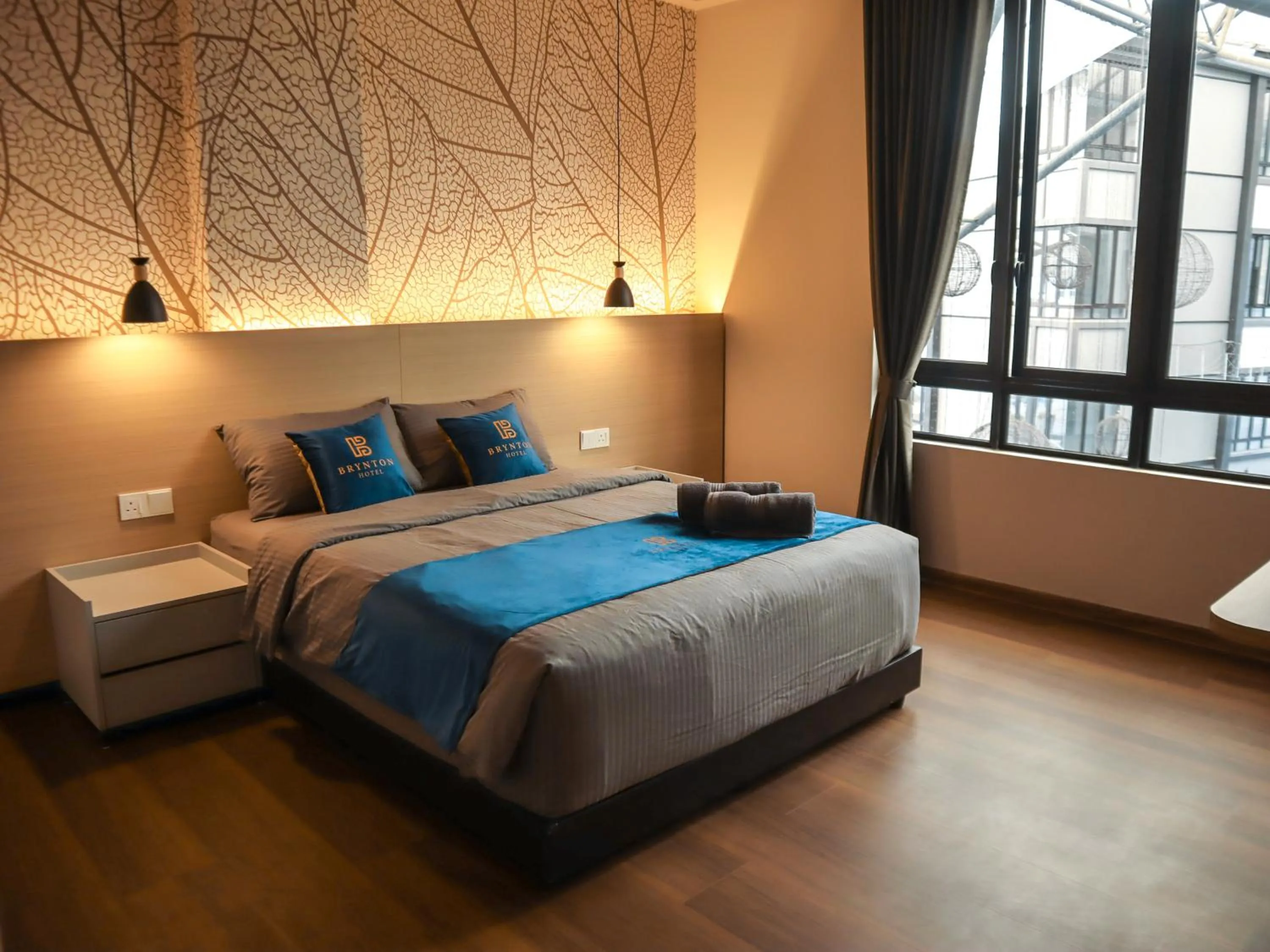 Bed in Hotel Brynton at Cameron Centrum Mall