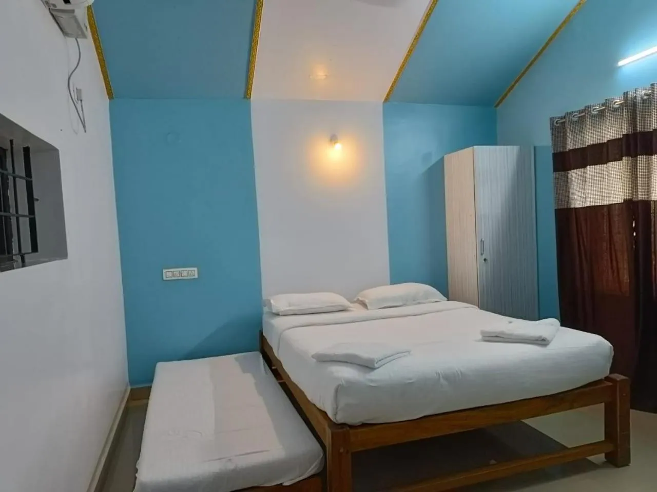 Bed in Poornima Beach Stay