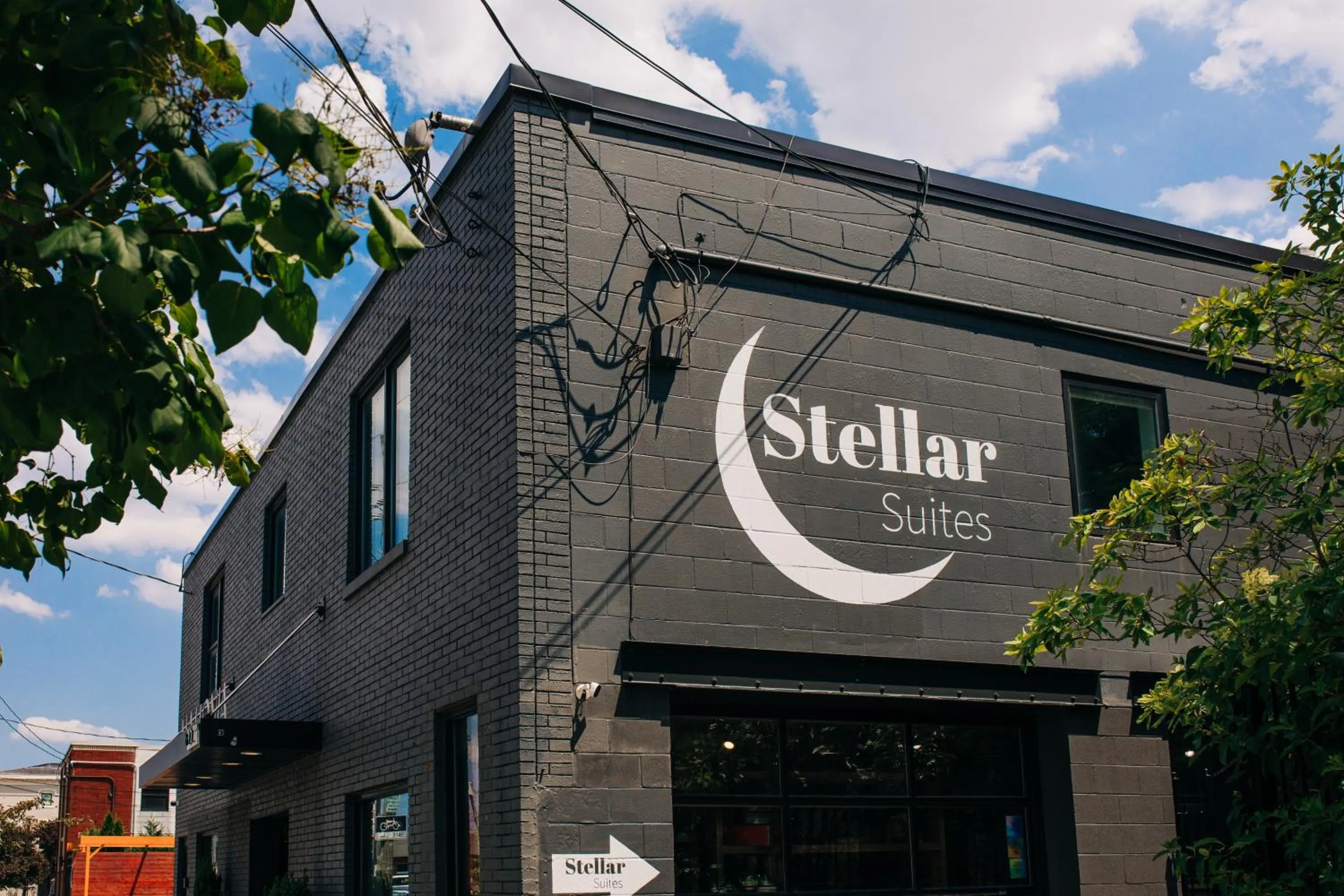 Property logo or sign in Stellar Suites