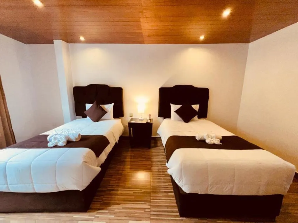 Bed in SAYACMARCA CLASSIC Inn