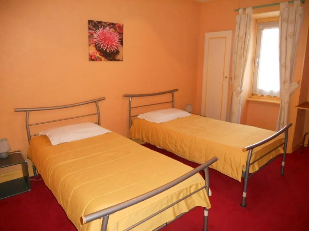 Bed in Hôtel de la Gare