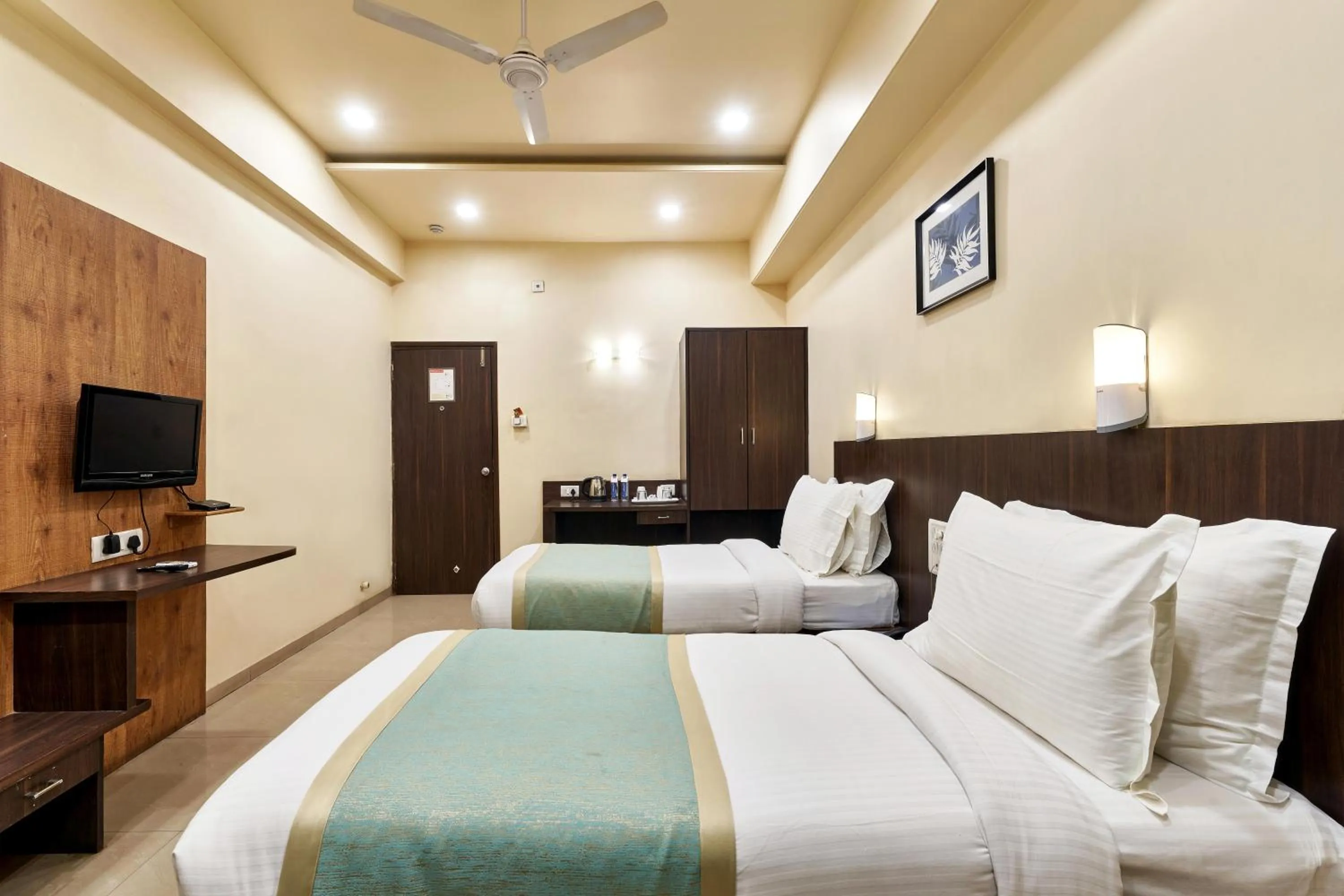 Photo of the whole room, Bed in Hotel Atria, Kolhapur