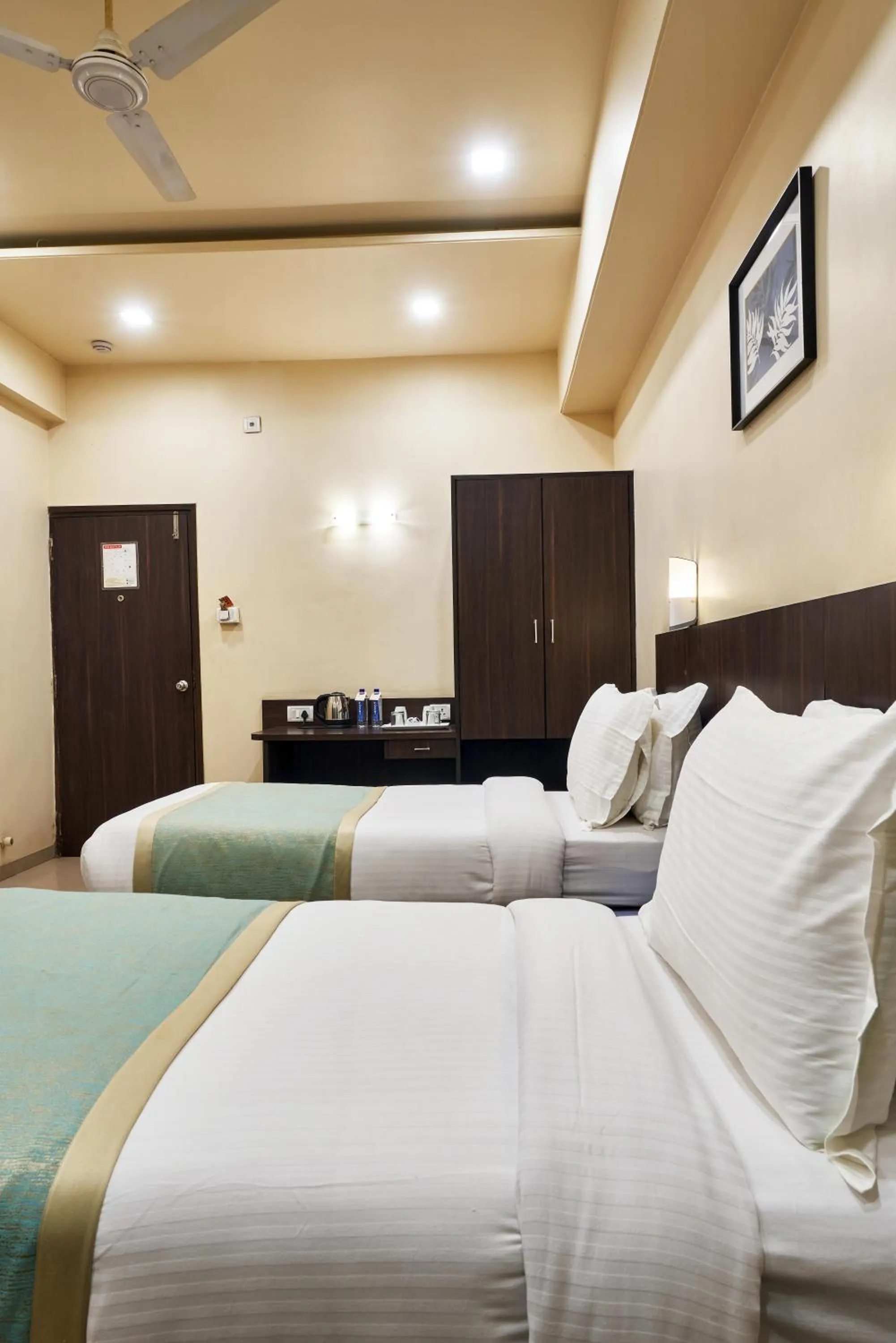 Photo of the whole room, Bed in Hotel Atria, Kolhapur