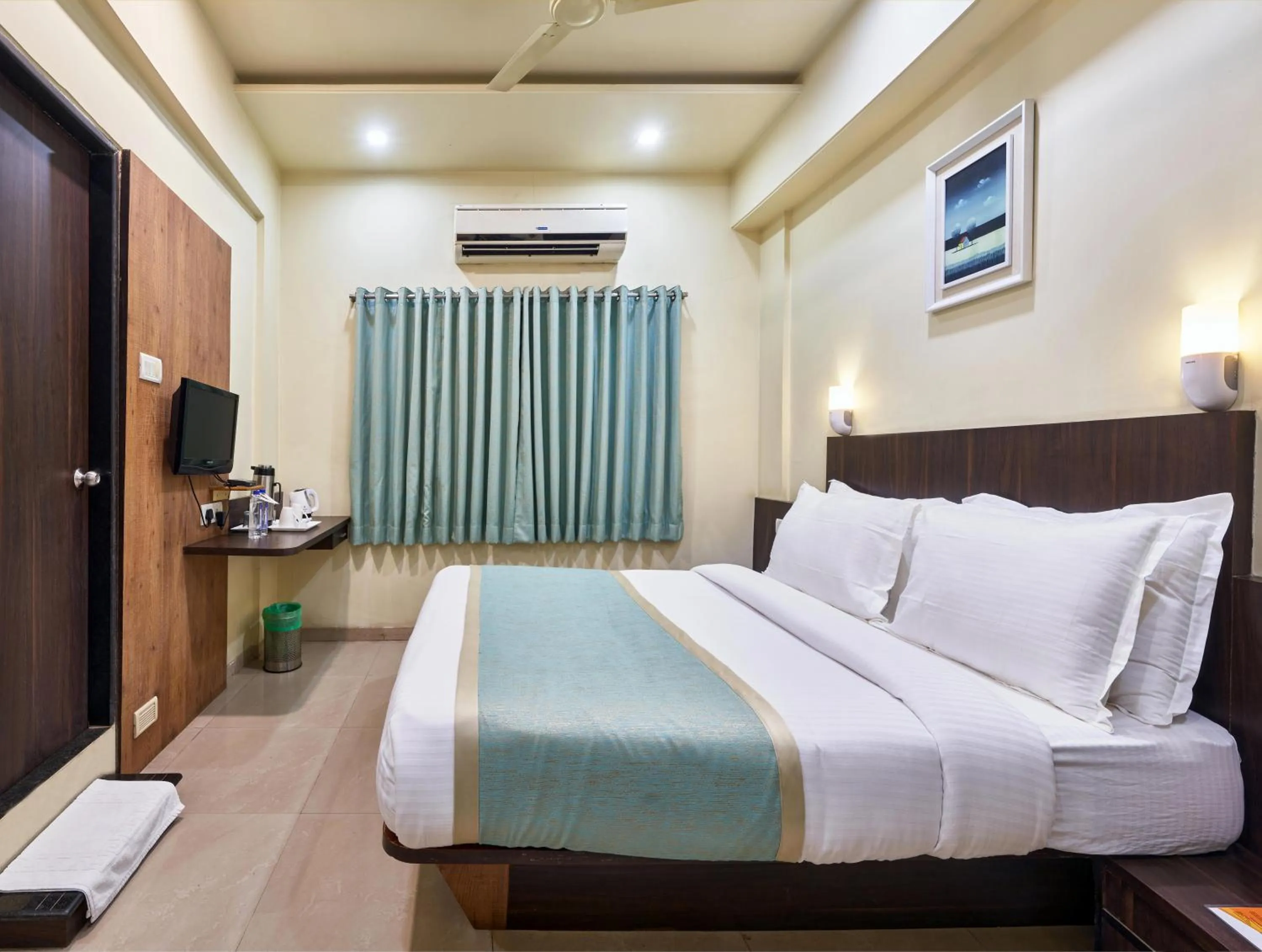Photo of the whole room, Bed in Hotel Atria, Kolhapur