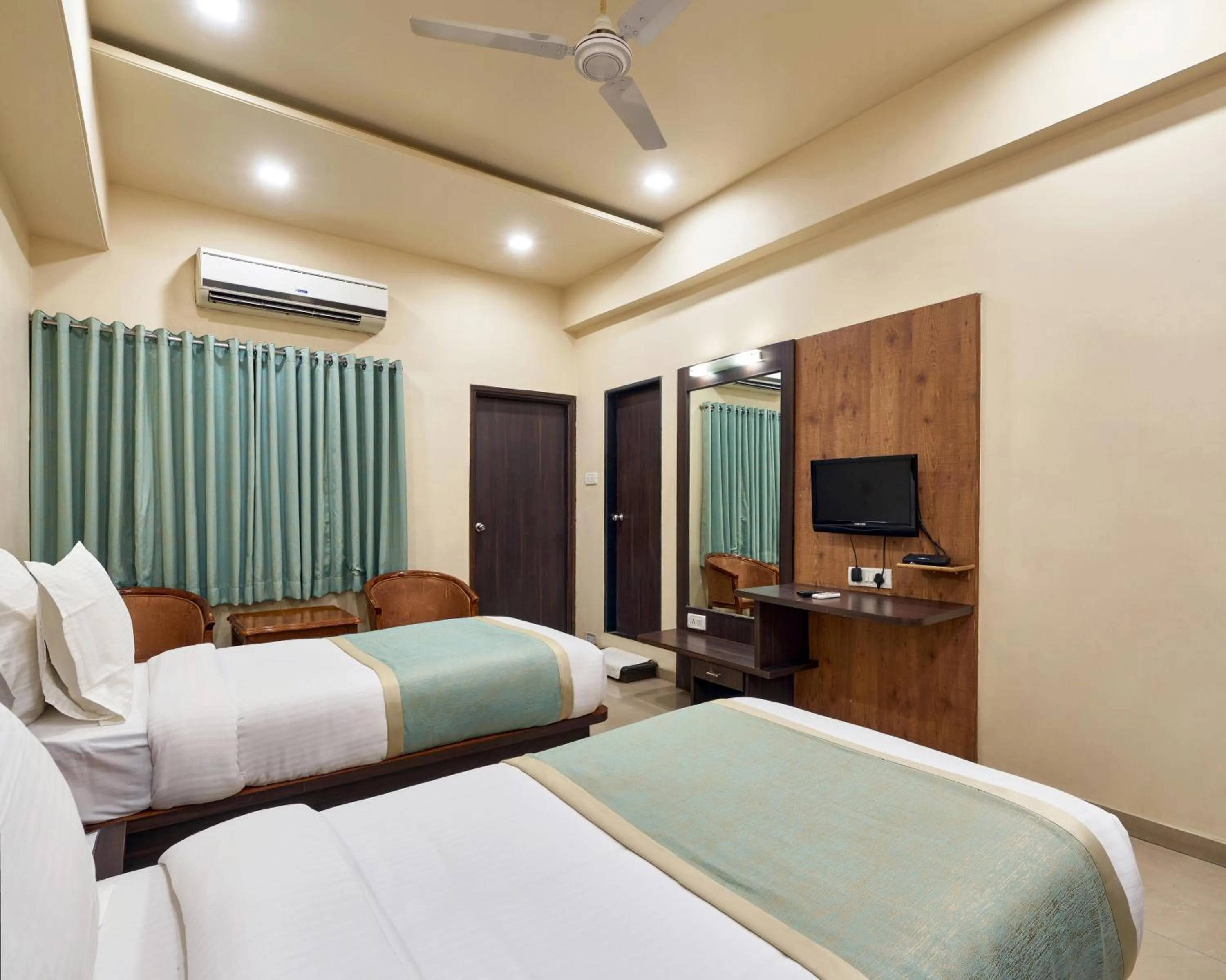 Photo of the whole room, Bed in Hotel Atria, Kolhapur