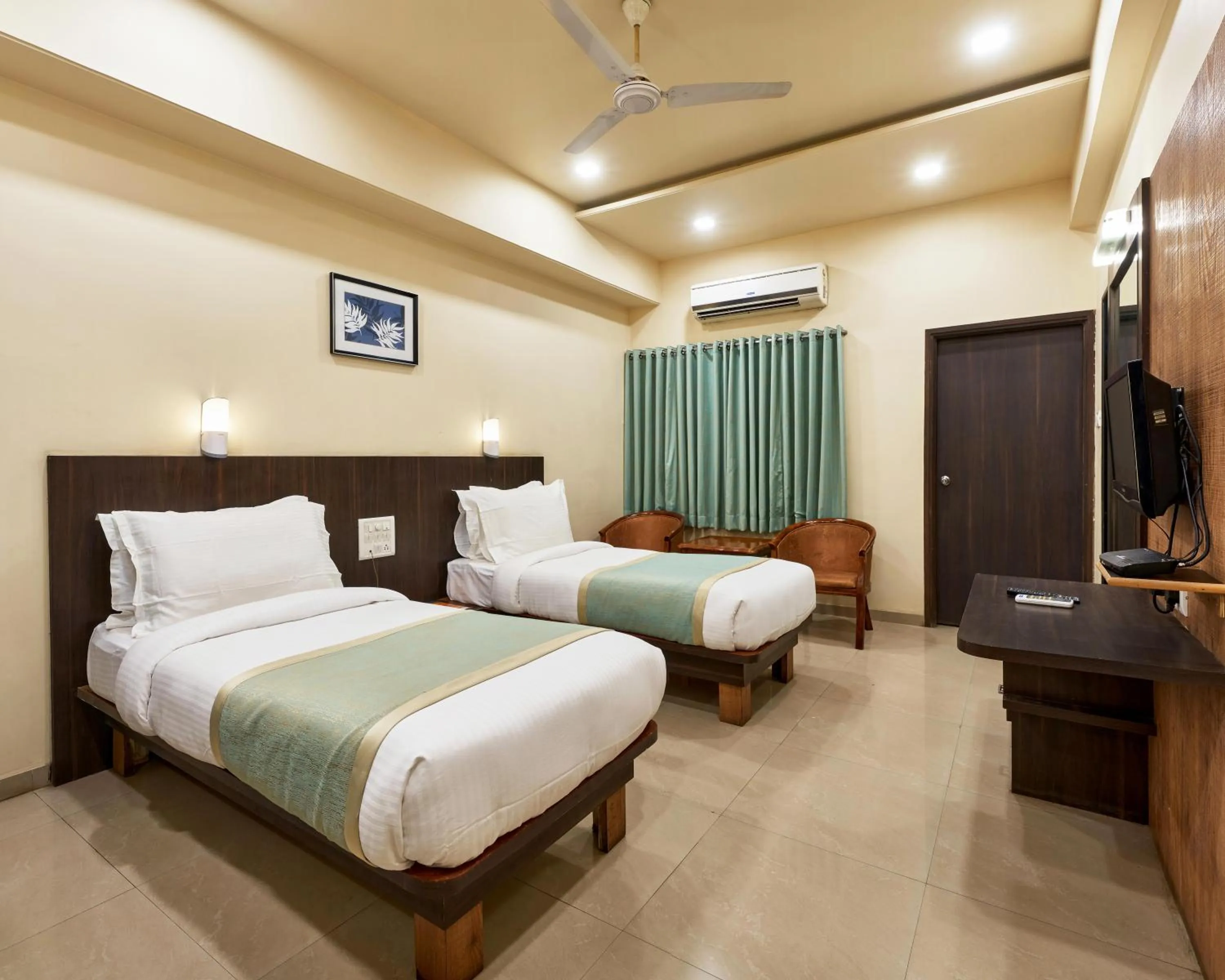 Photo of the whole room, Bed in Hotel Atria, Kolhapur