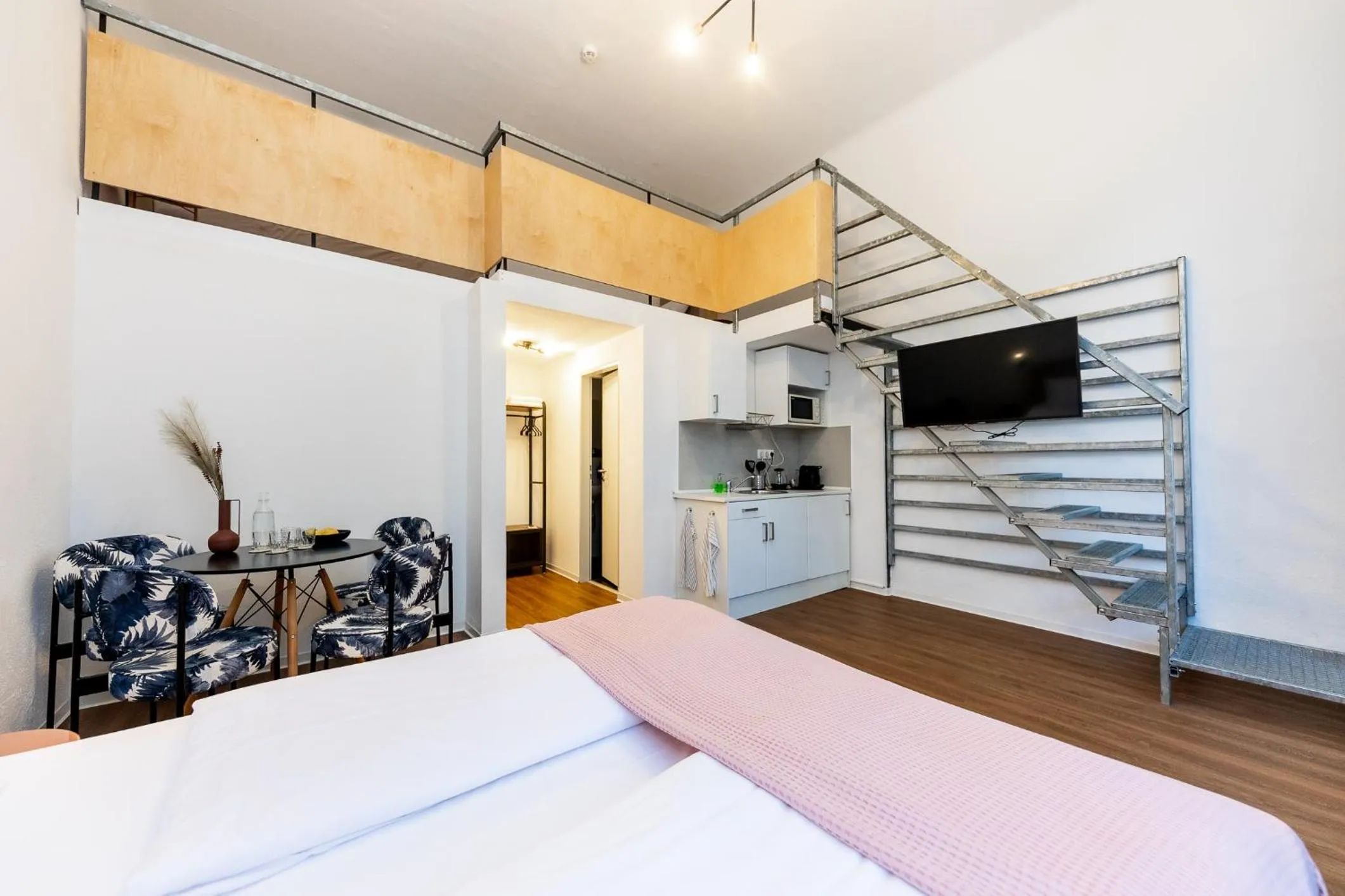 Bed in Adagio Downtown Rooms