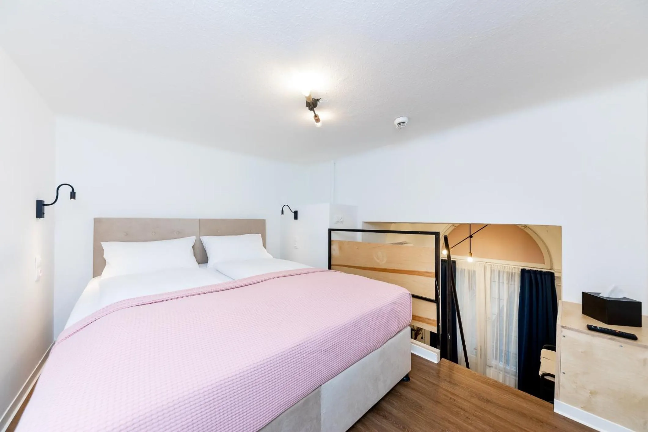 Bed in Adagio Downtown Rooms