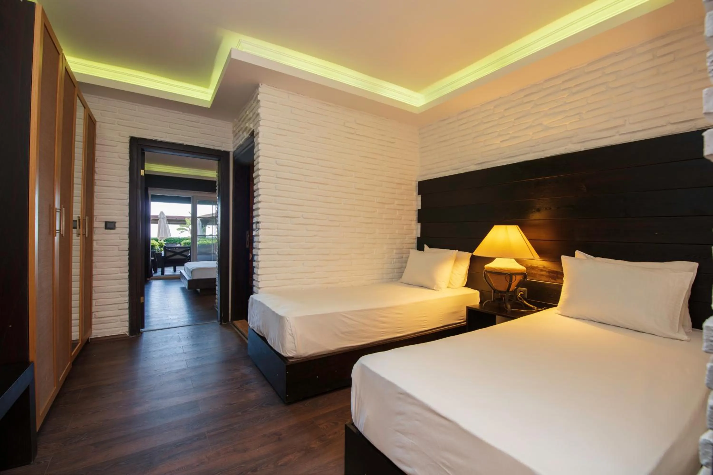 Bed in Manaspark Deluxe Hotel