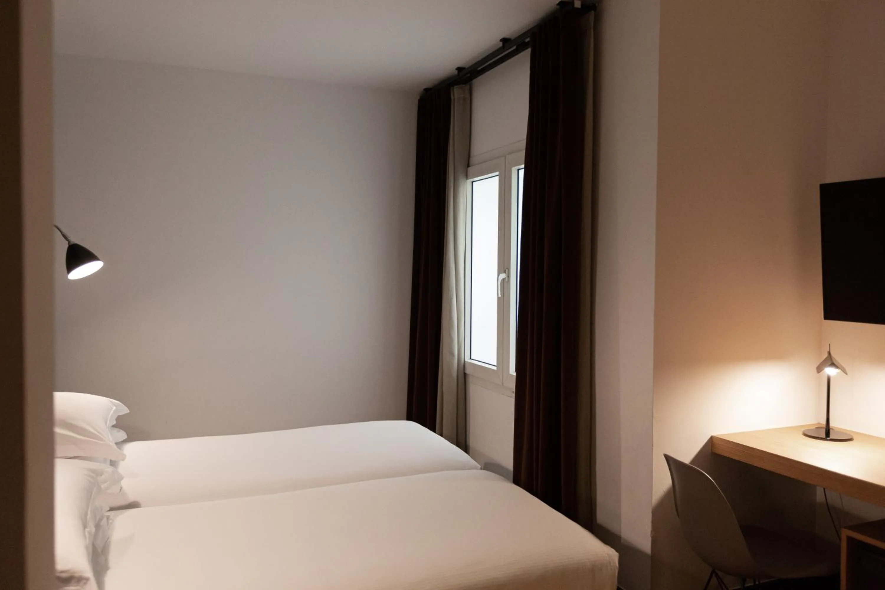 Bed in Alexandra Barcelona Hotel, Curio Collection by Hilton