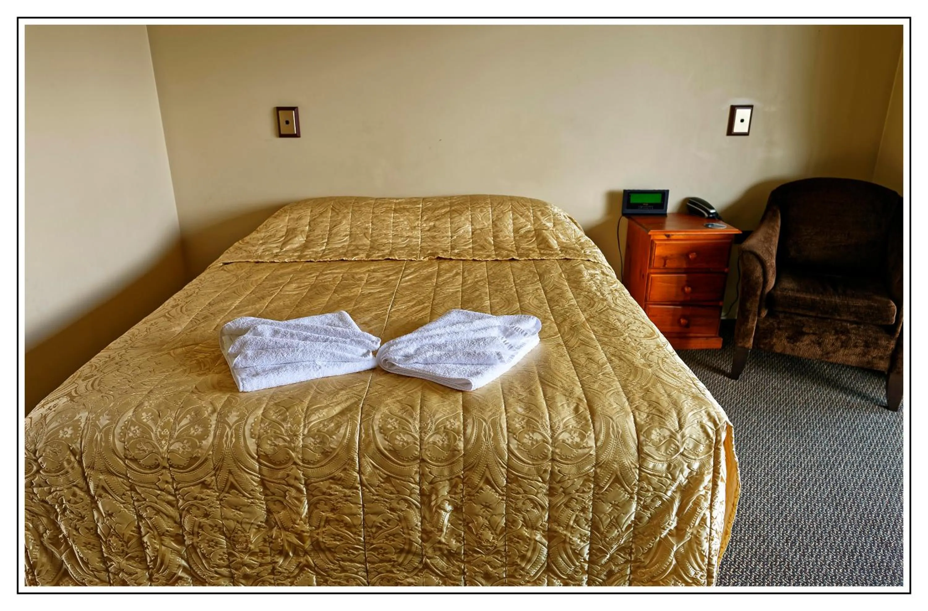 Bed in Lantern Court Motel