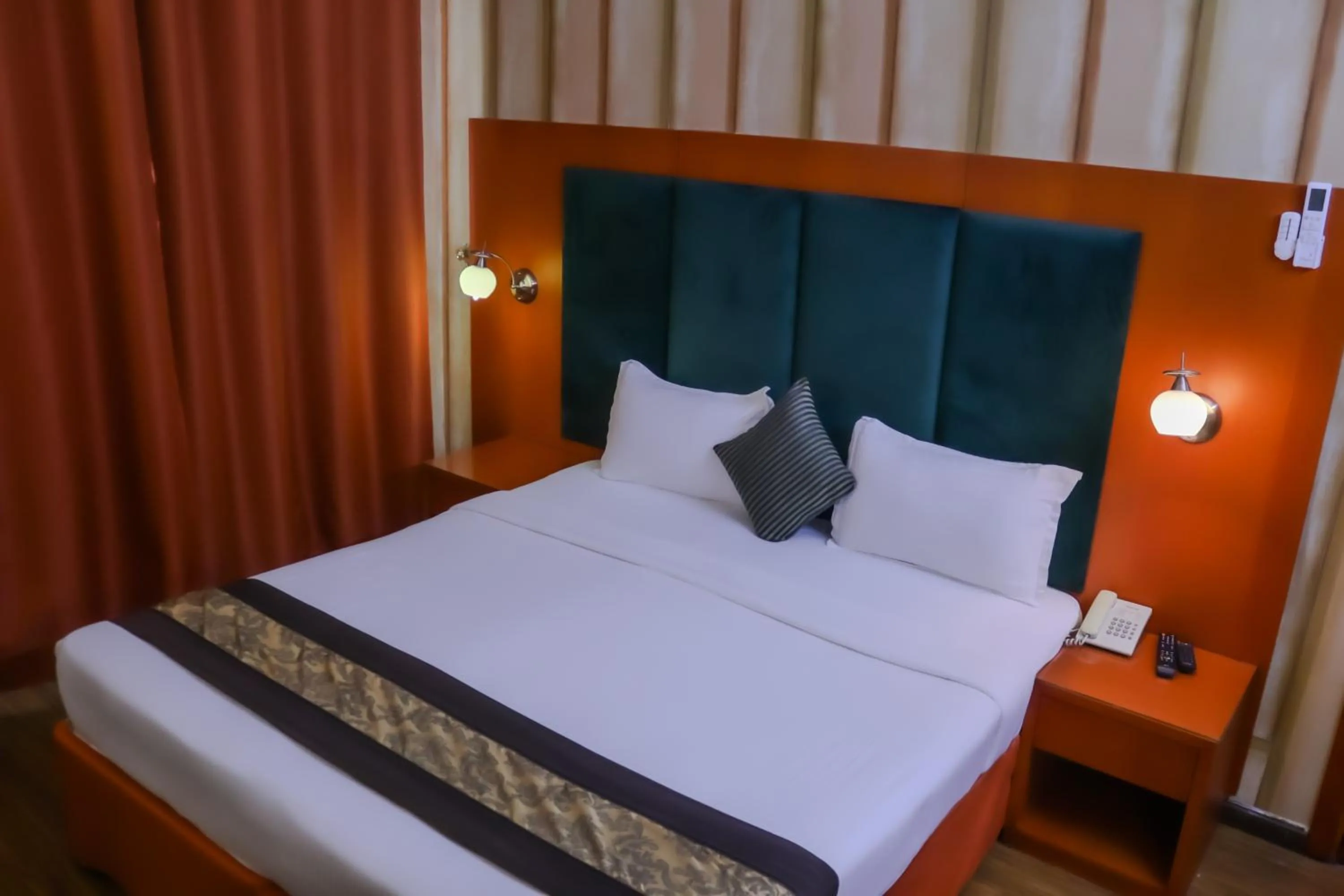 Bed in BOONMAX Hotel