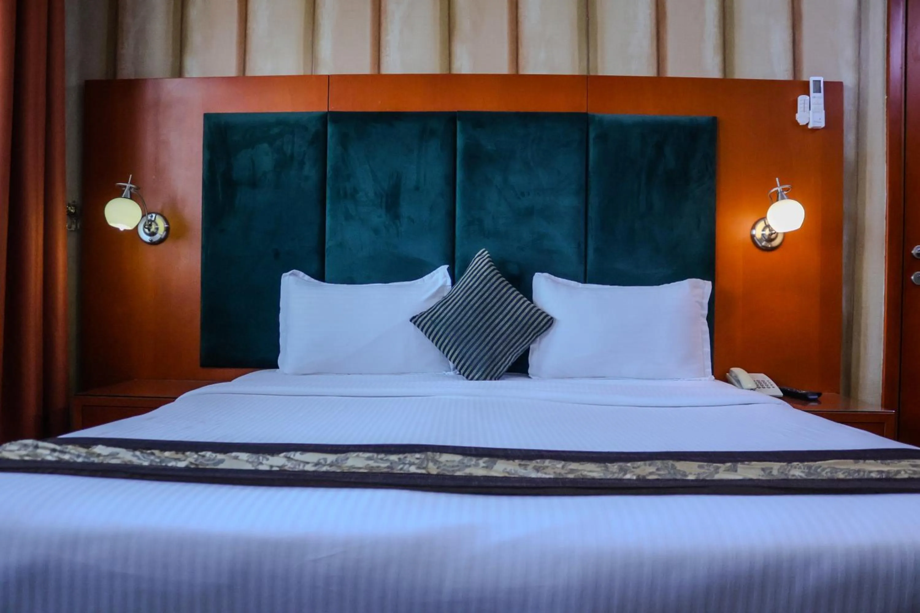 Bed in BOONMAX Hotel