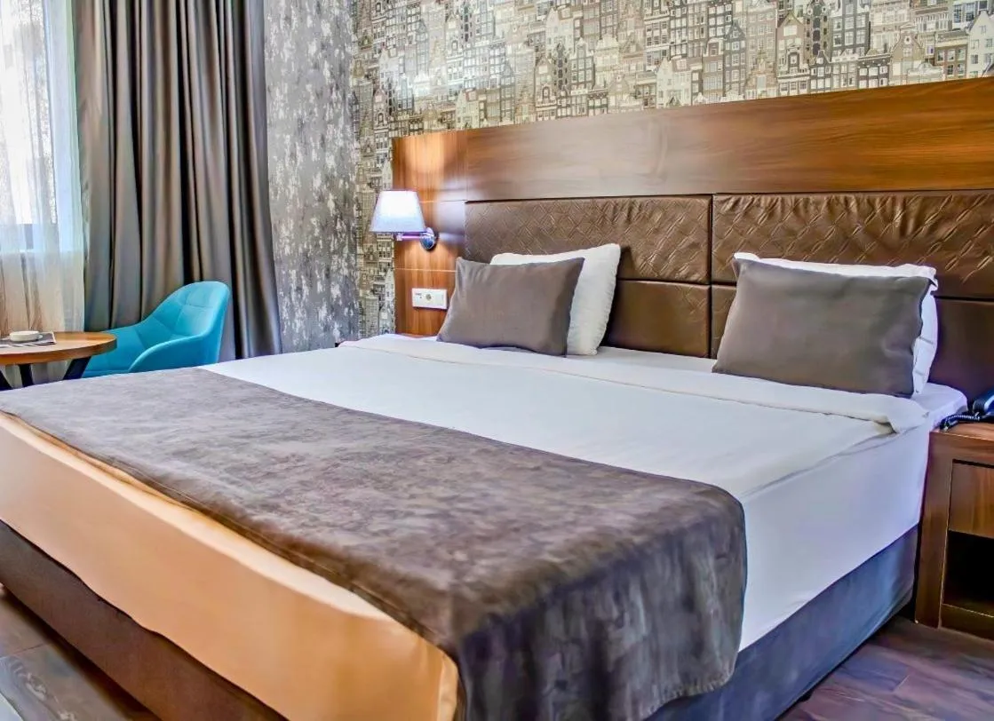 Bed in Ma City Hotel