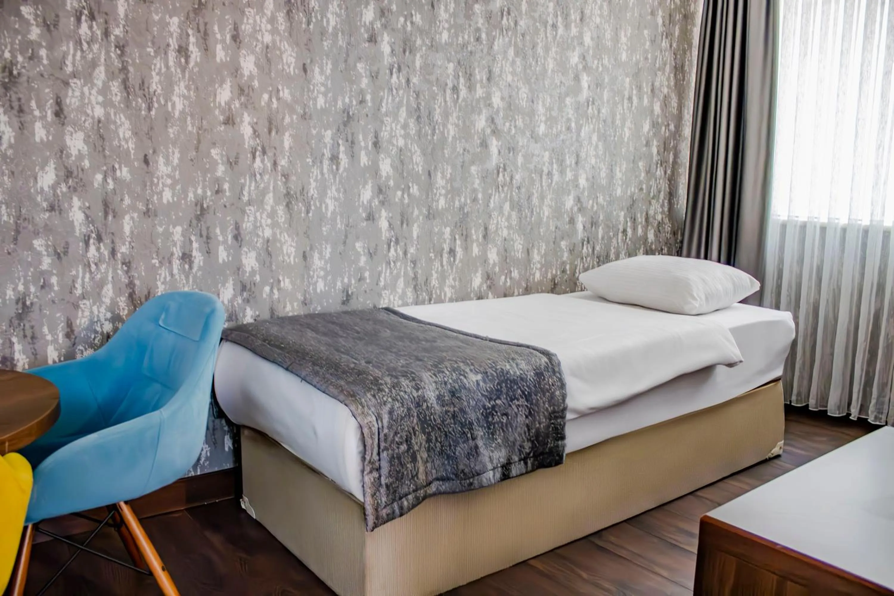 Bed in Ma City Hotel