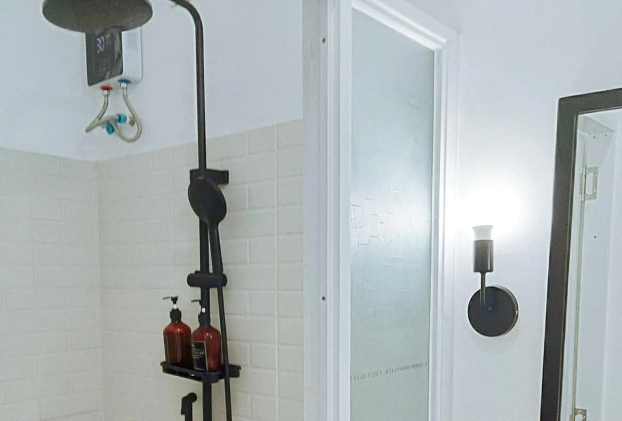 Shower in Angels Bed and Breakfast Sipalay City by RedDoorz