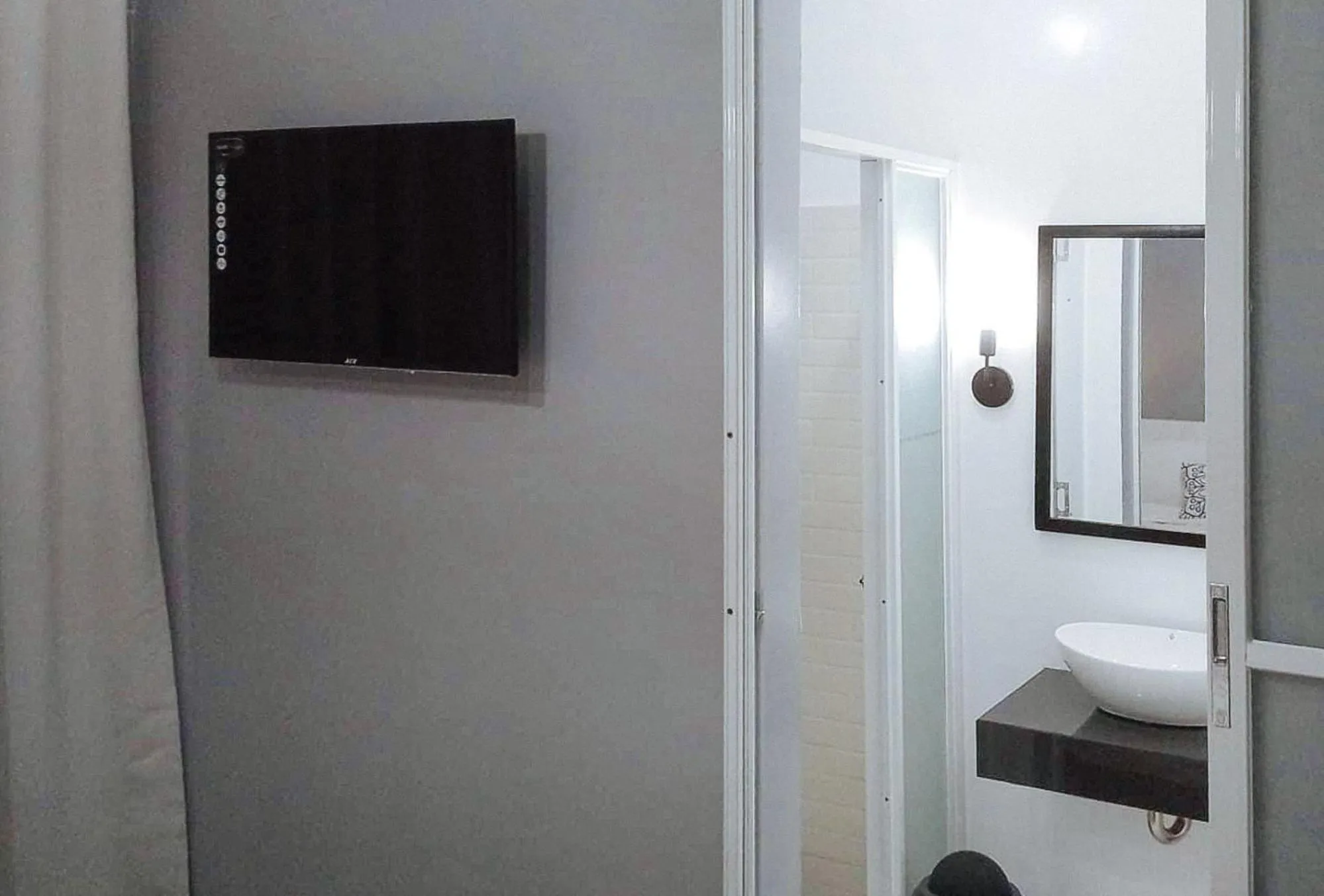 TV and multimedia in Angels Bed and Breakfast Sipalay City by RedDoorz