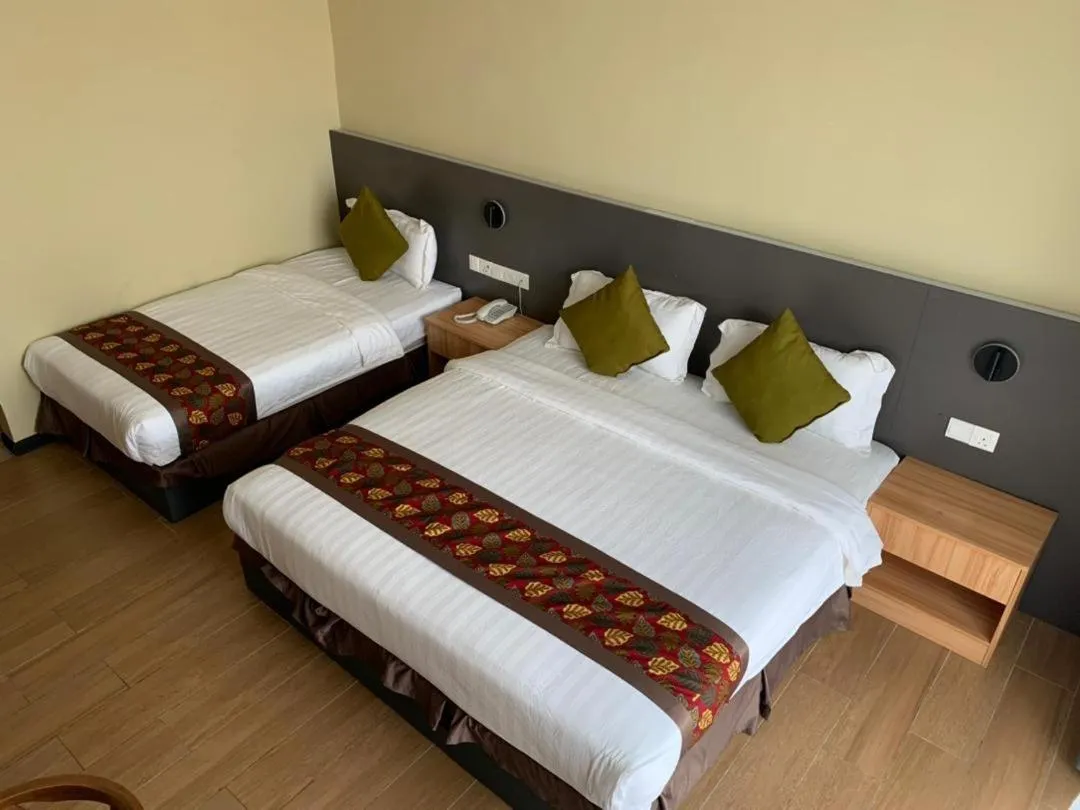 Bed in Wing Tat Grand Hotel