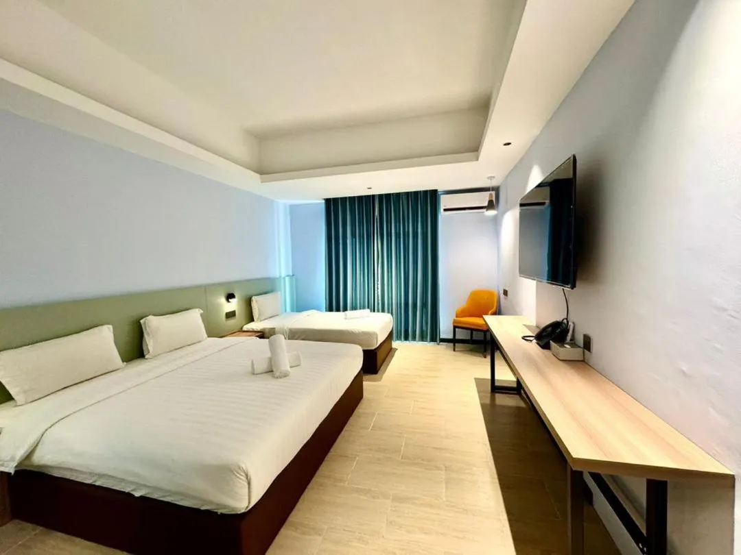 Bed in Wing Tat Grand Hotel