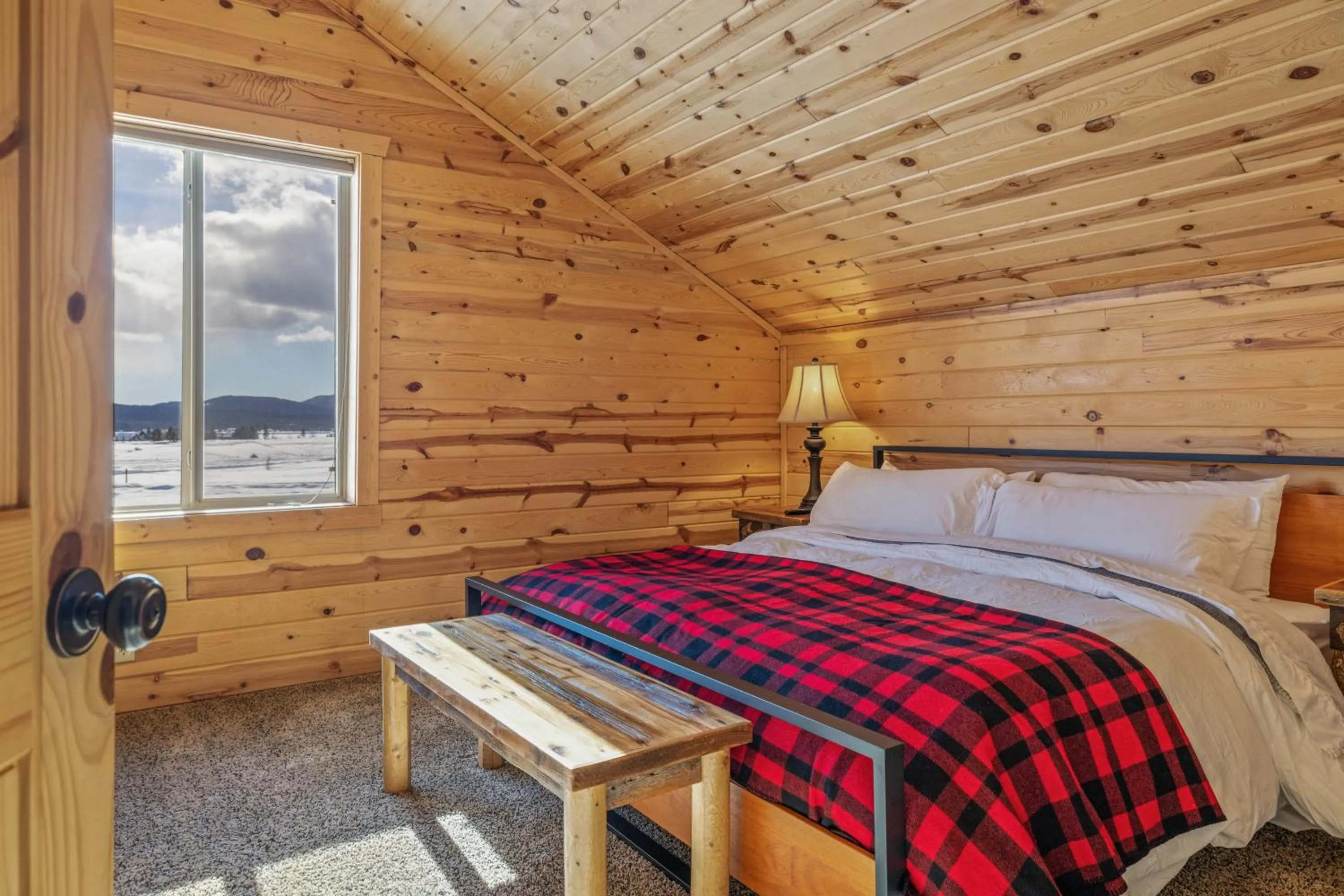 Bed in Liberty Lodge by KABINO Hot Tub Air Hockey 3 Living Rooms 7 bedrooms Boat Launch Reservoir ATV Snowmobile Trails WiFi