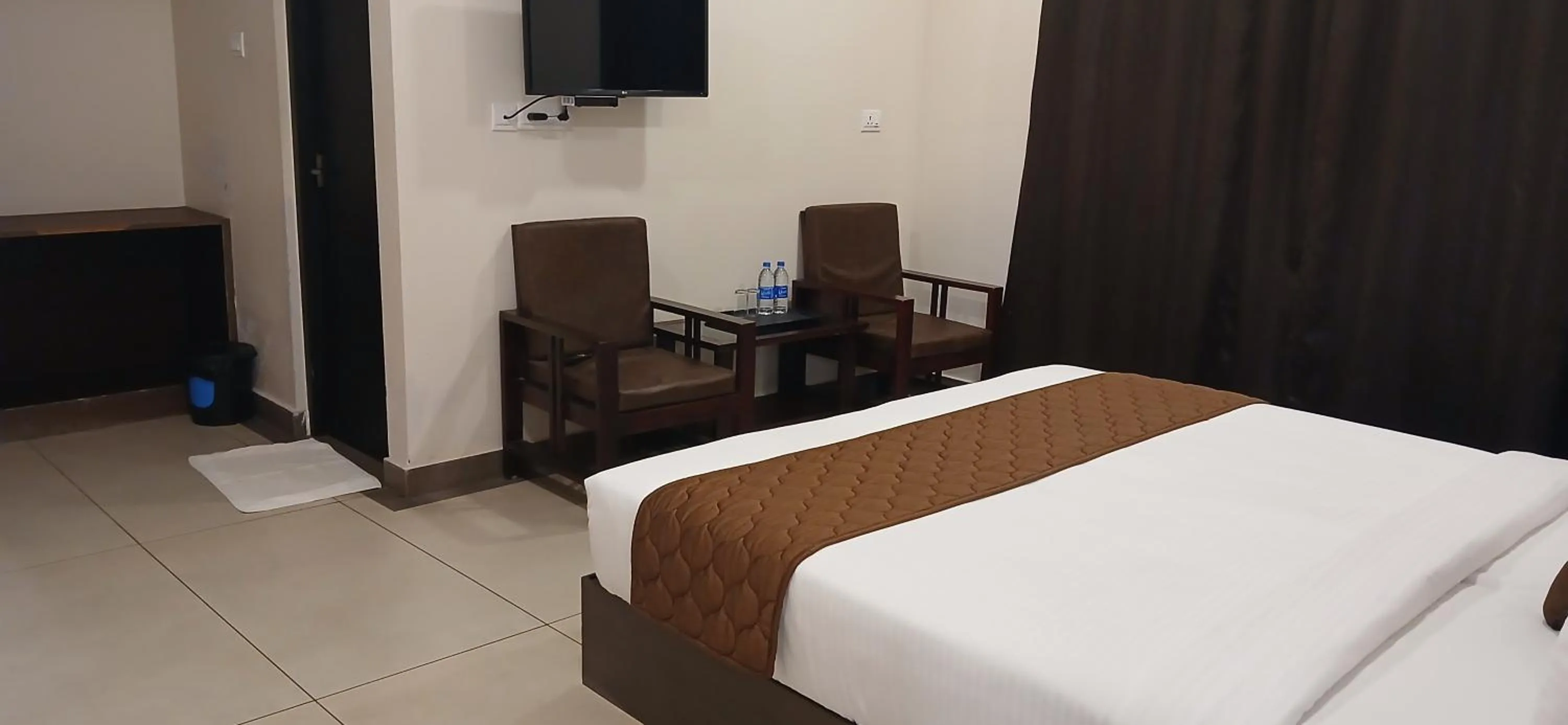 Bed in HOTEL PANKAJ RESIDENCY