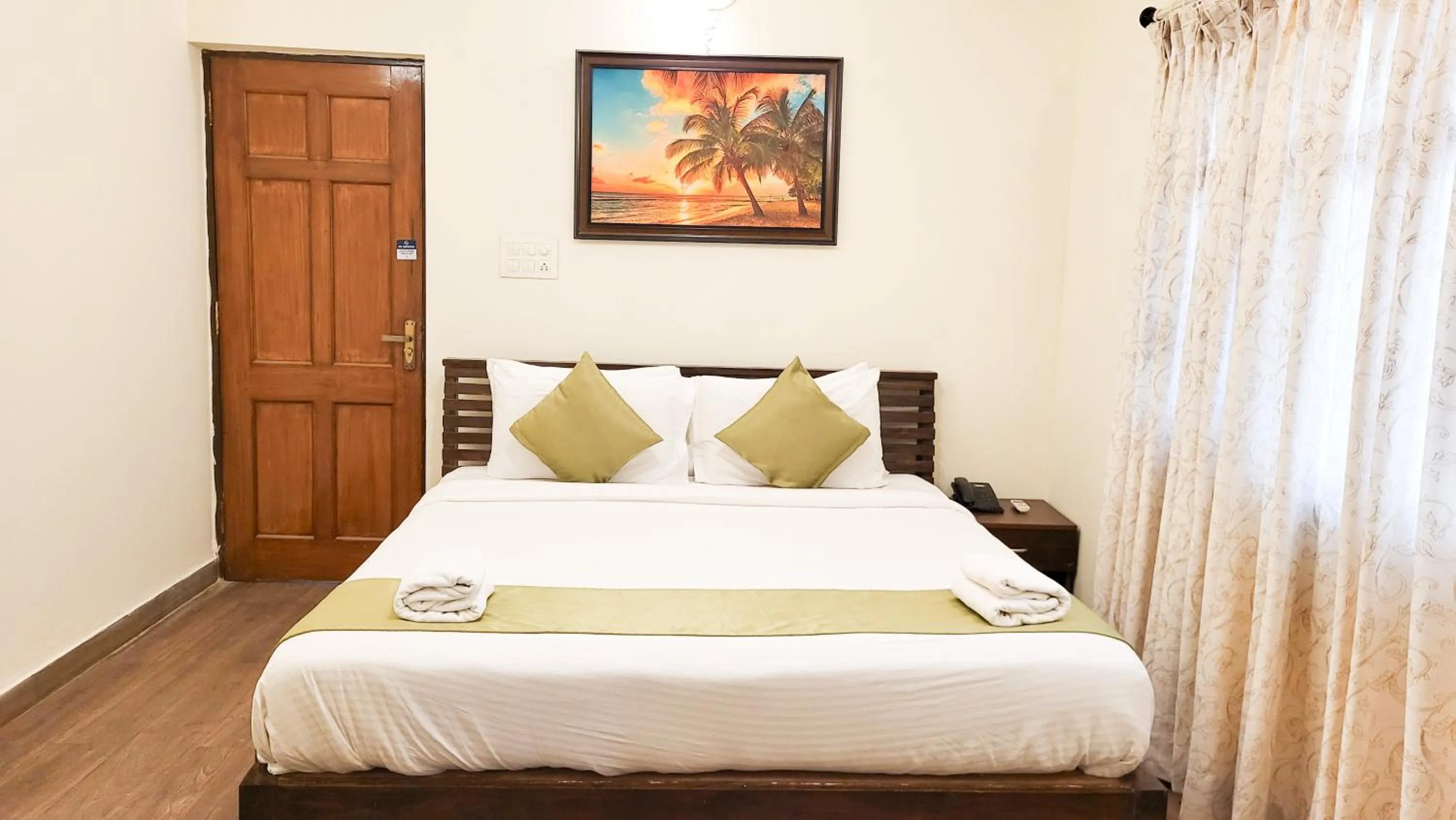 Bed in Stone Wood Riverfront Resort, Siolim