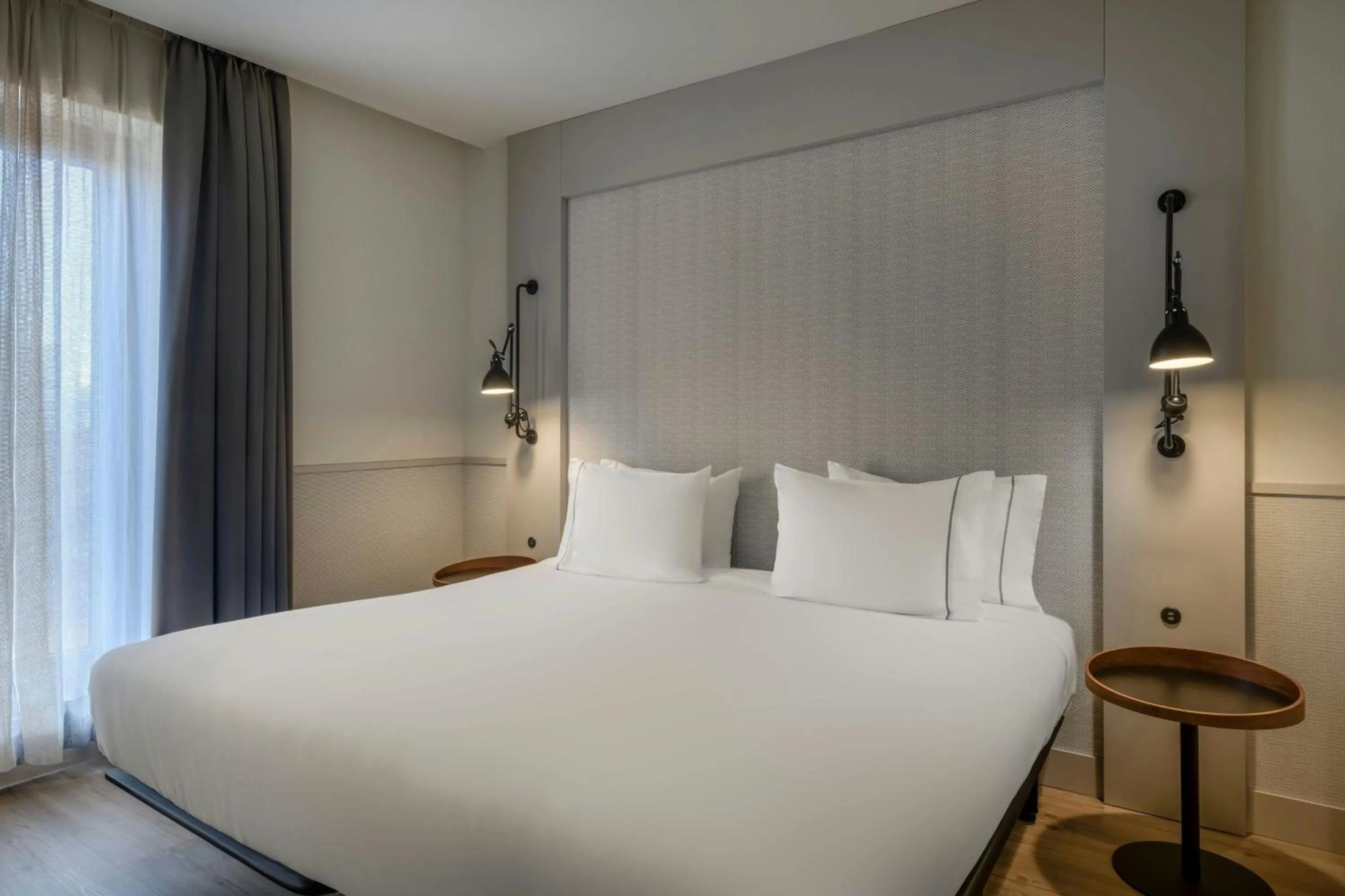 Photo of the whole room, Bed in AC Hotel Los Vascos by Marriott