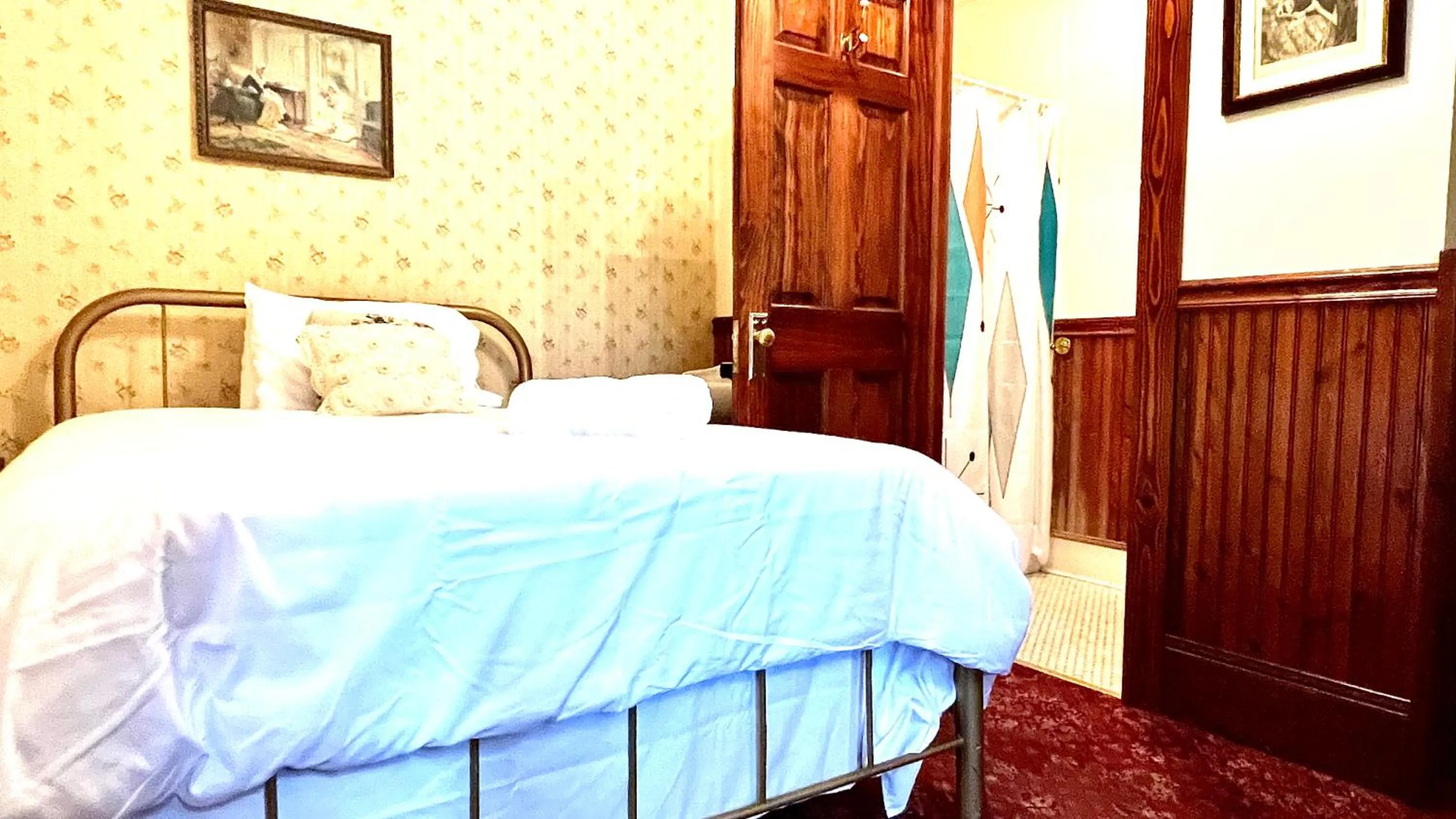 Bed in Hotel La More at The Bisbee Inn