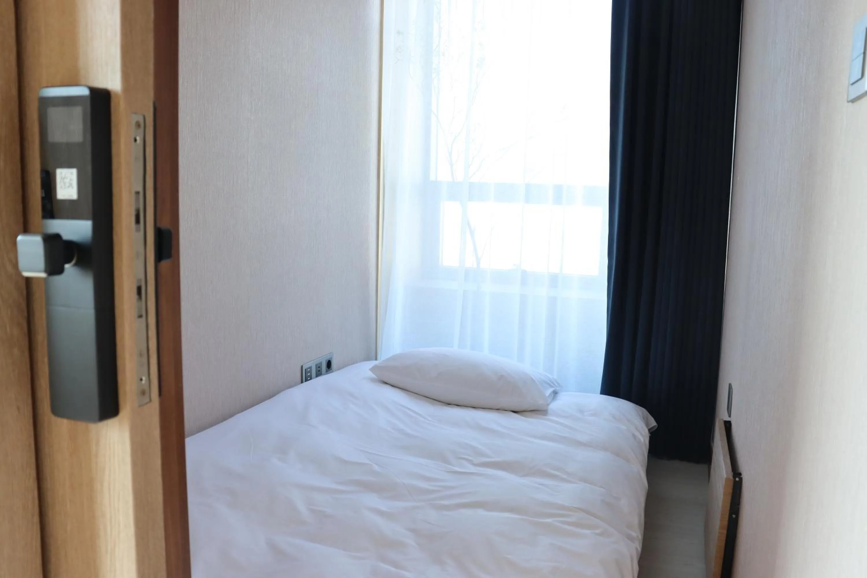 Bed in Hotel tt Gupo