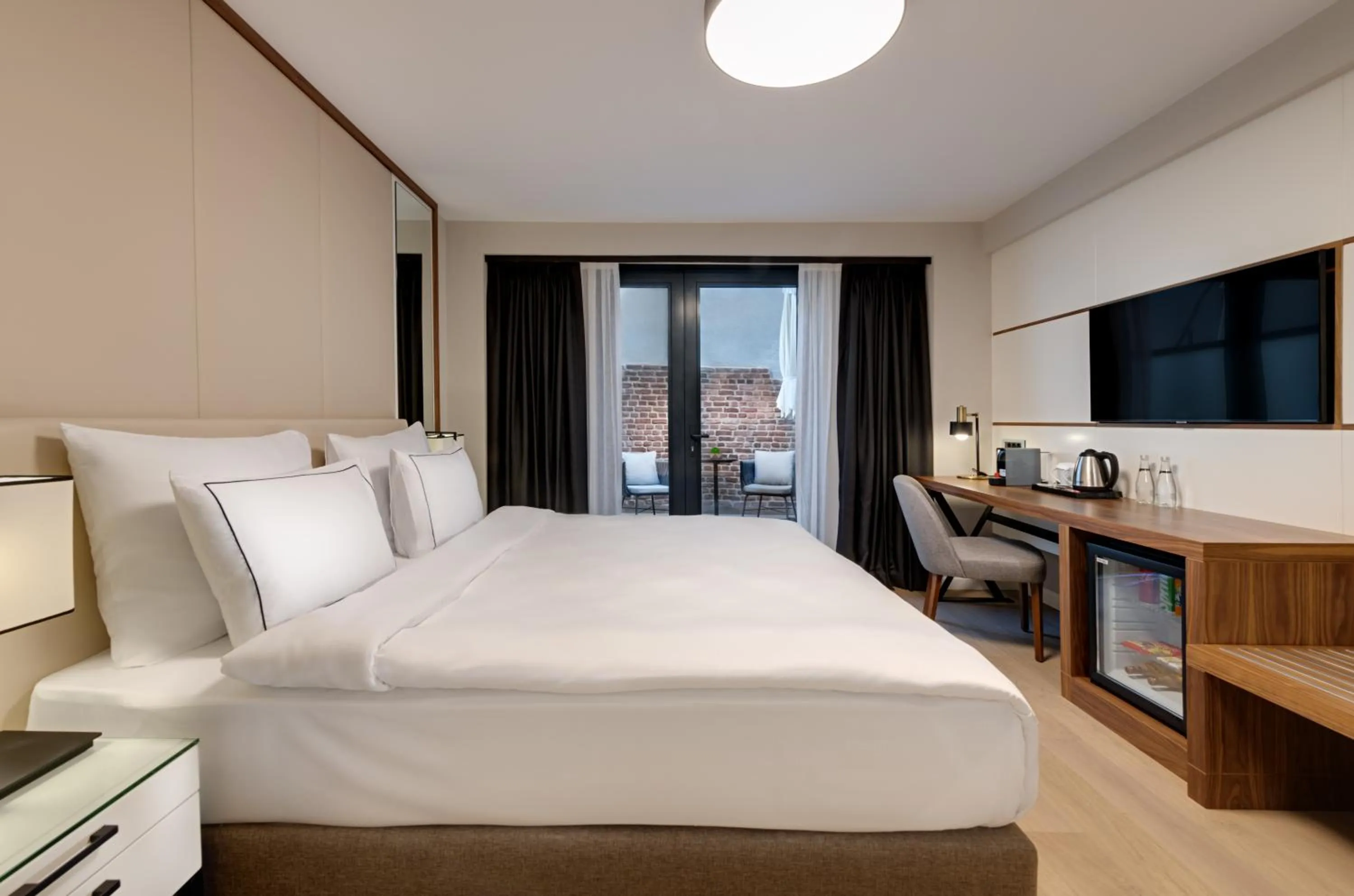 Bed in Gleam Collection Hotel