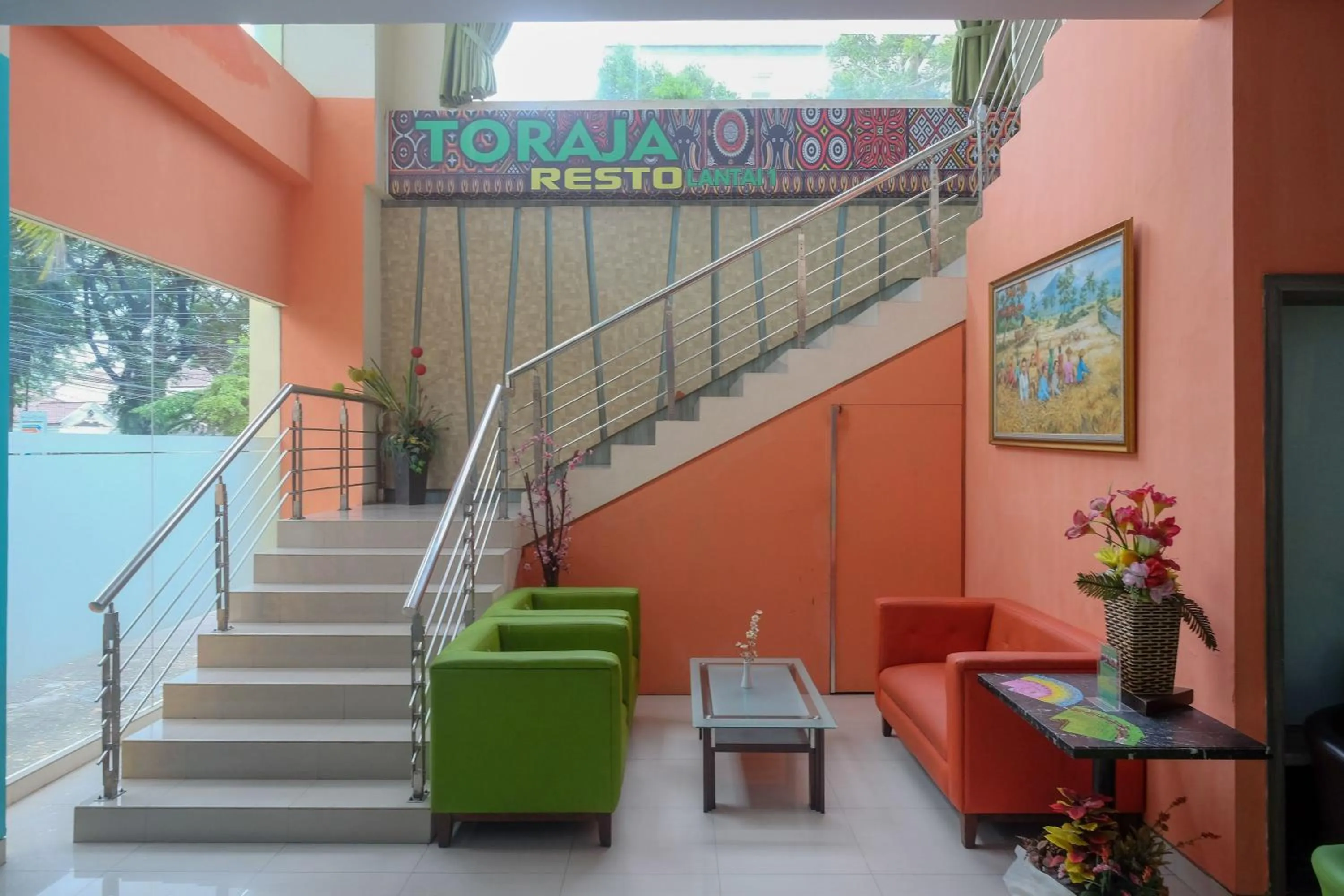 Seating area in Sans Hotel Lynt Makassar