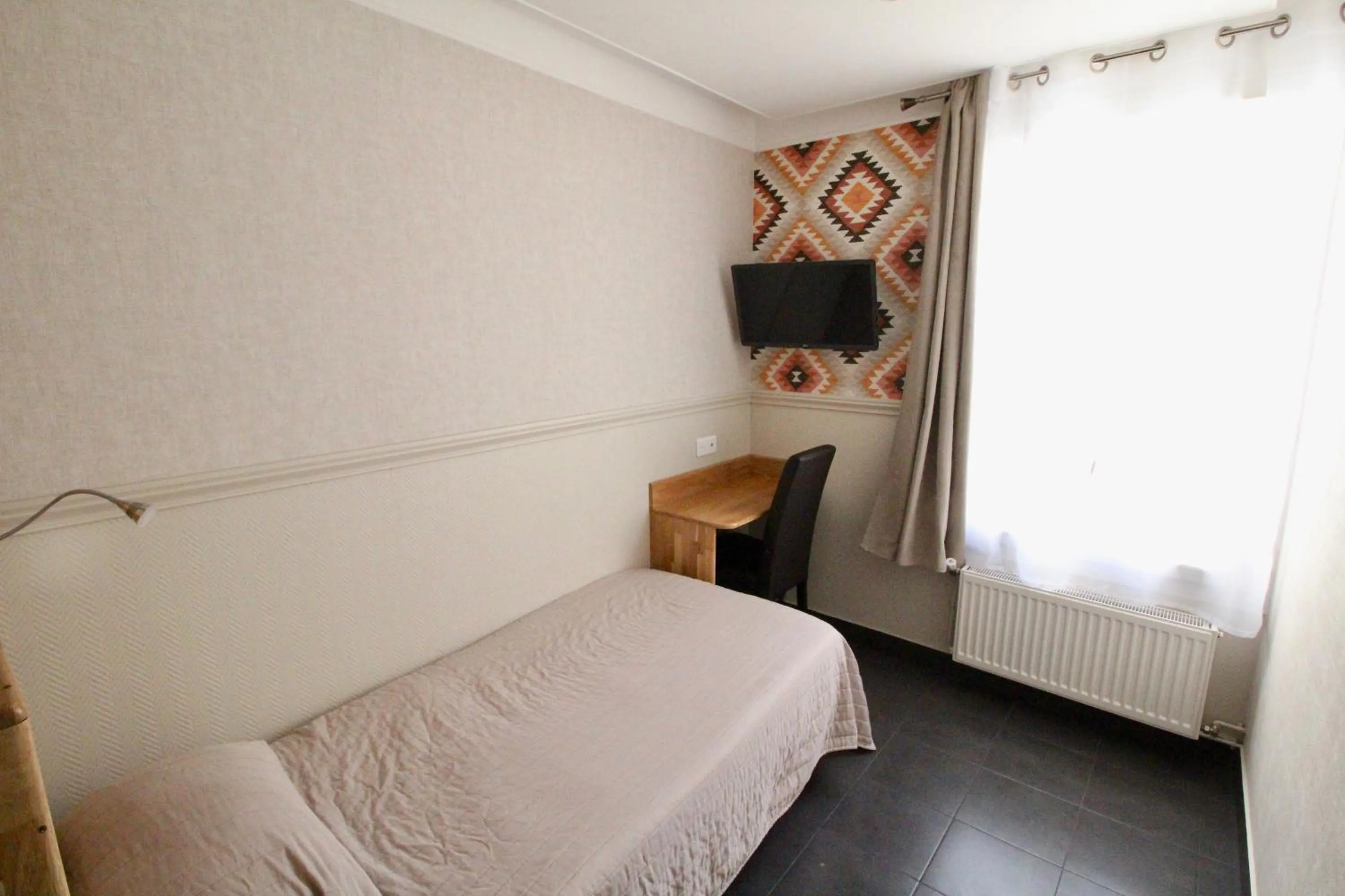 Bed in Hotel des Pyrénées