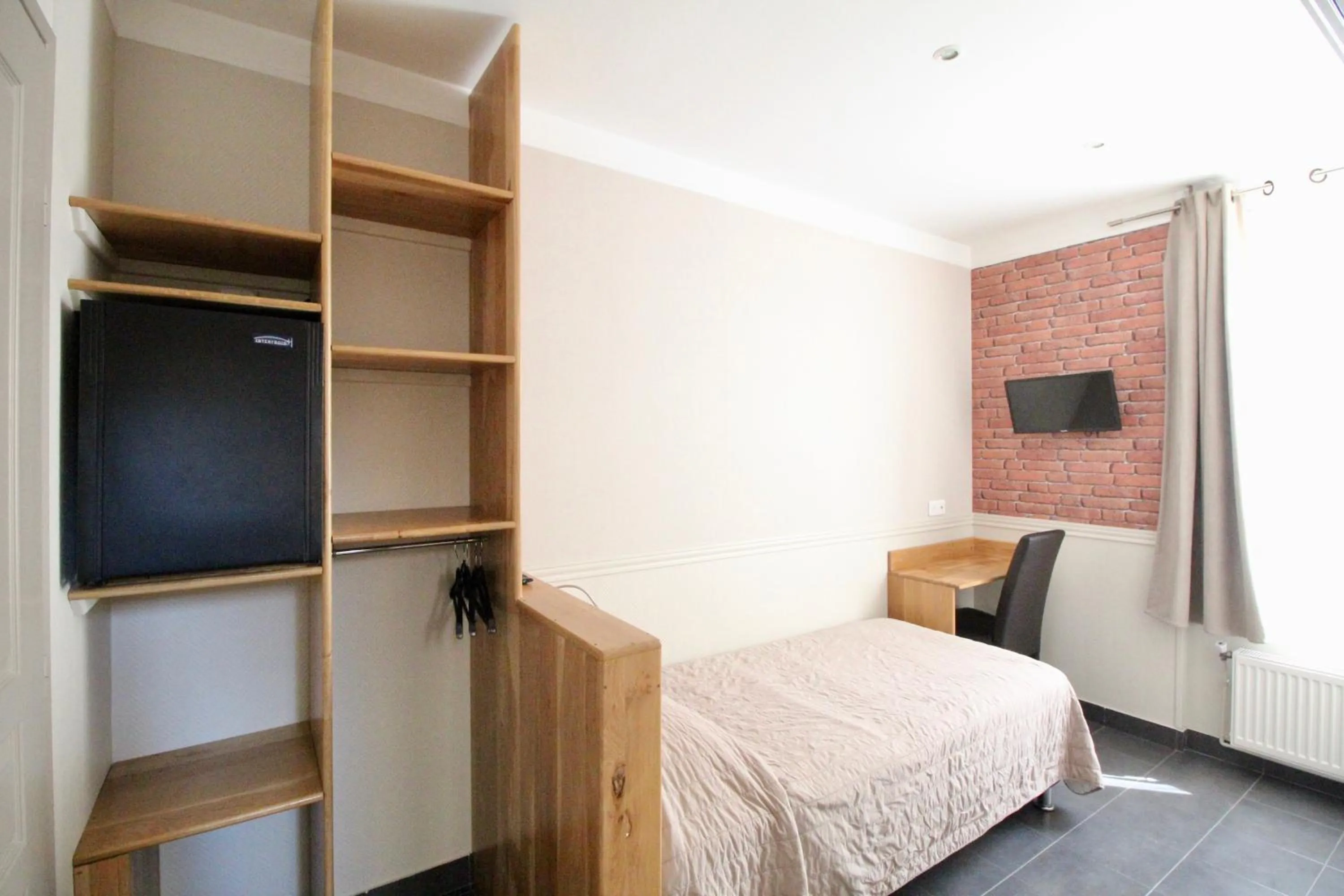 Photo of the whole room, Bed in Hotel des Pyrénées